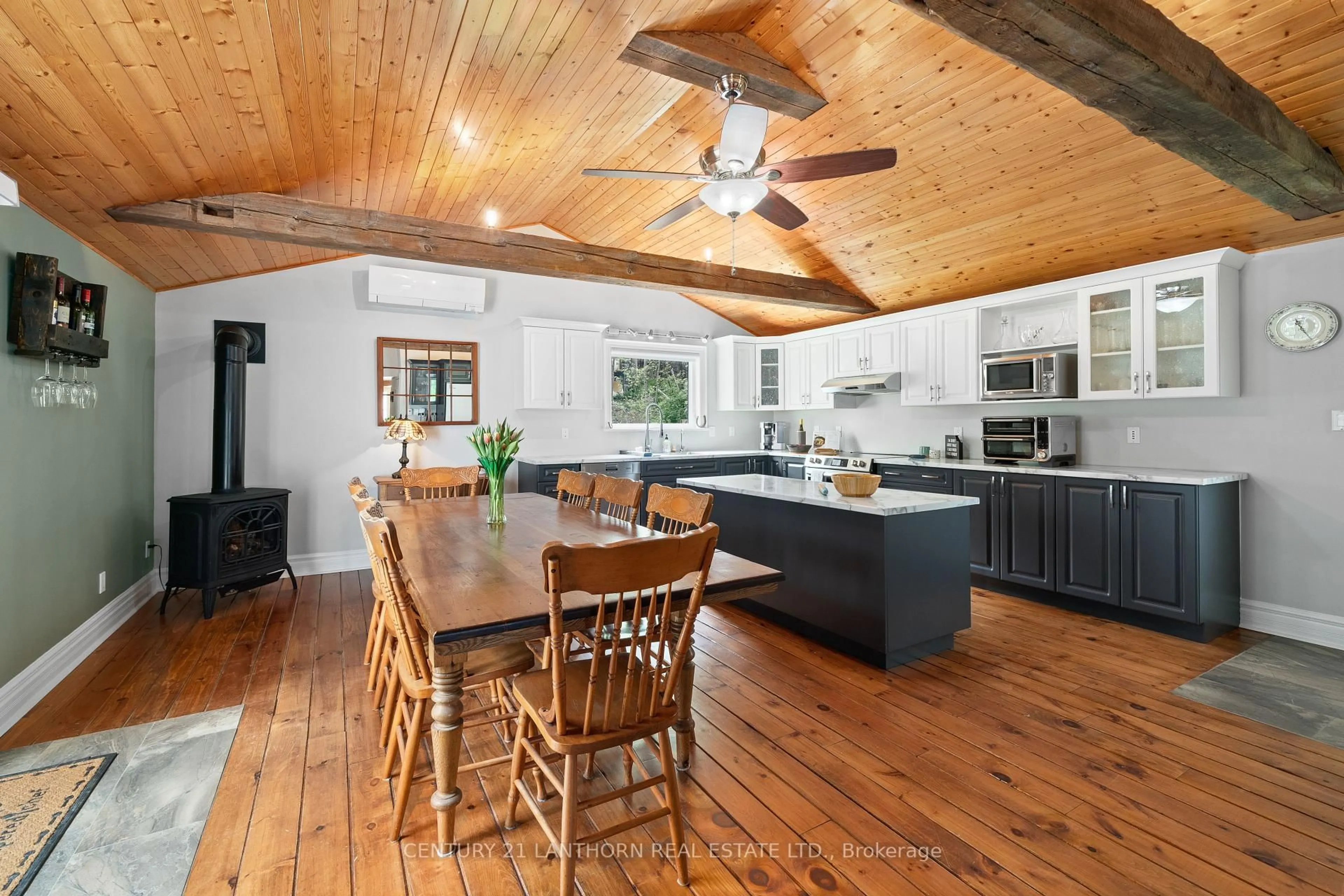 Open concept kitchen, wood/laminate floor for 1647 County 10 Rd, Prince Edward County Ontario K0K 1P0