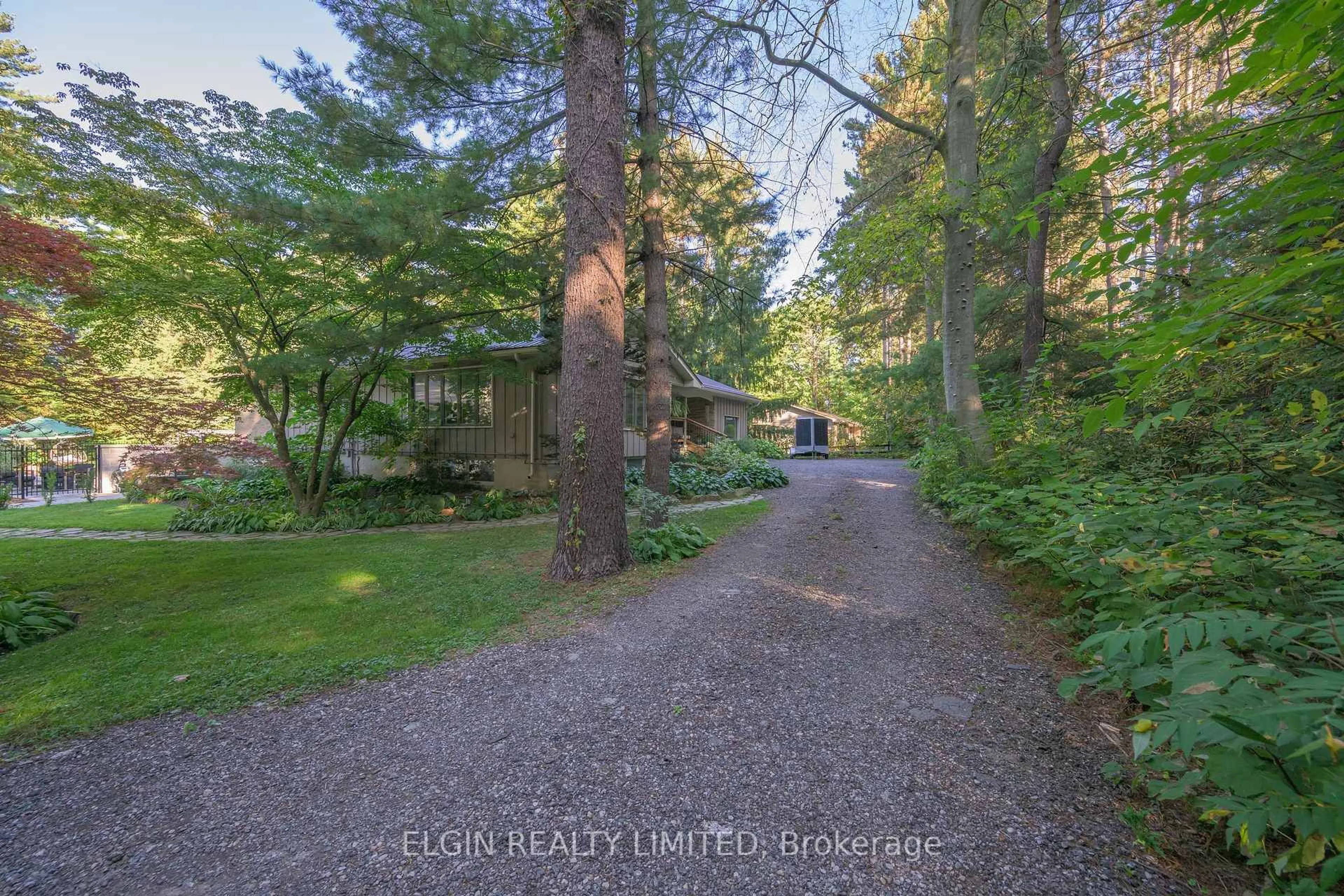 A pic from outside/outdoor area/front of a property/back of a property/a pic from drone, forest/trees view for 8031 ROGERS Rd, Malahide Ontario N5H 2R4
