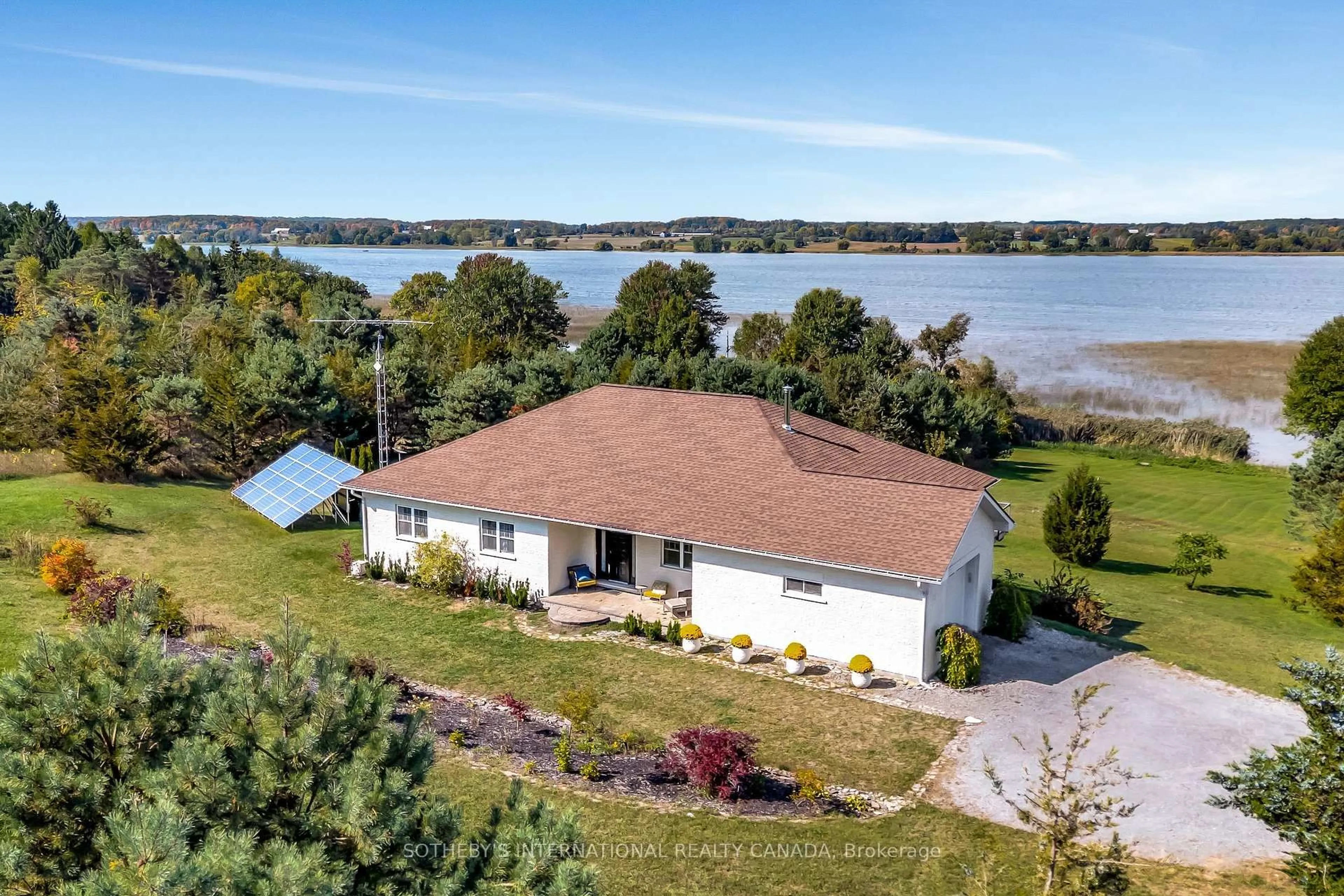 A pic from outside/outdoor area/front of a property/back of a property/a pic from drone, water/lake/river/ocean view for 188 County Road 18, Prince Edward County Ontario K0K 1P0