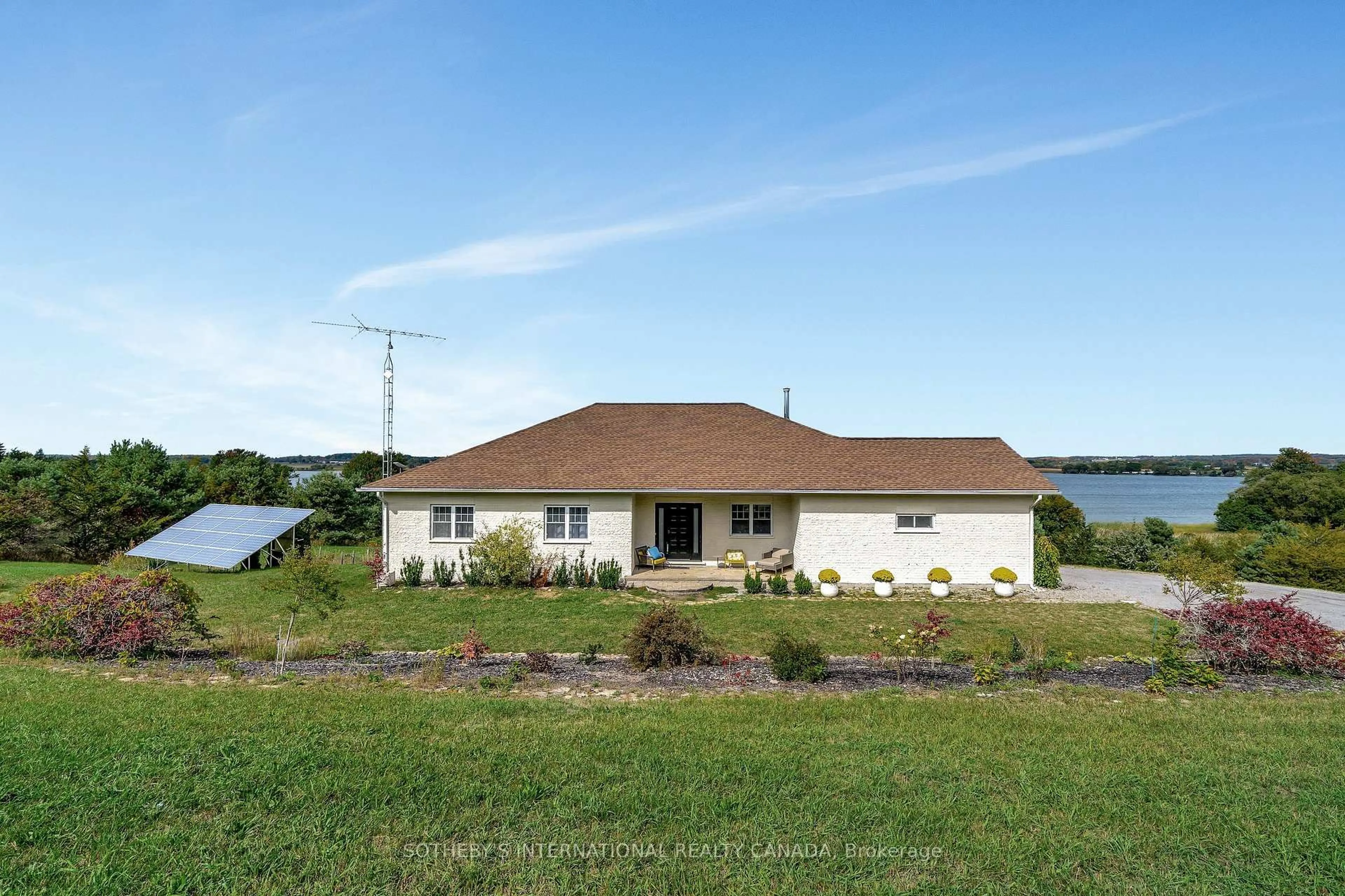 A pic from outside/outdoor area/front of a property/back of a property/a pic from drone, water/lake/river/ocean view for 188 County Road 18, Prince Edward County Ontario K0K 1P0