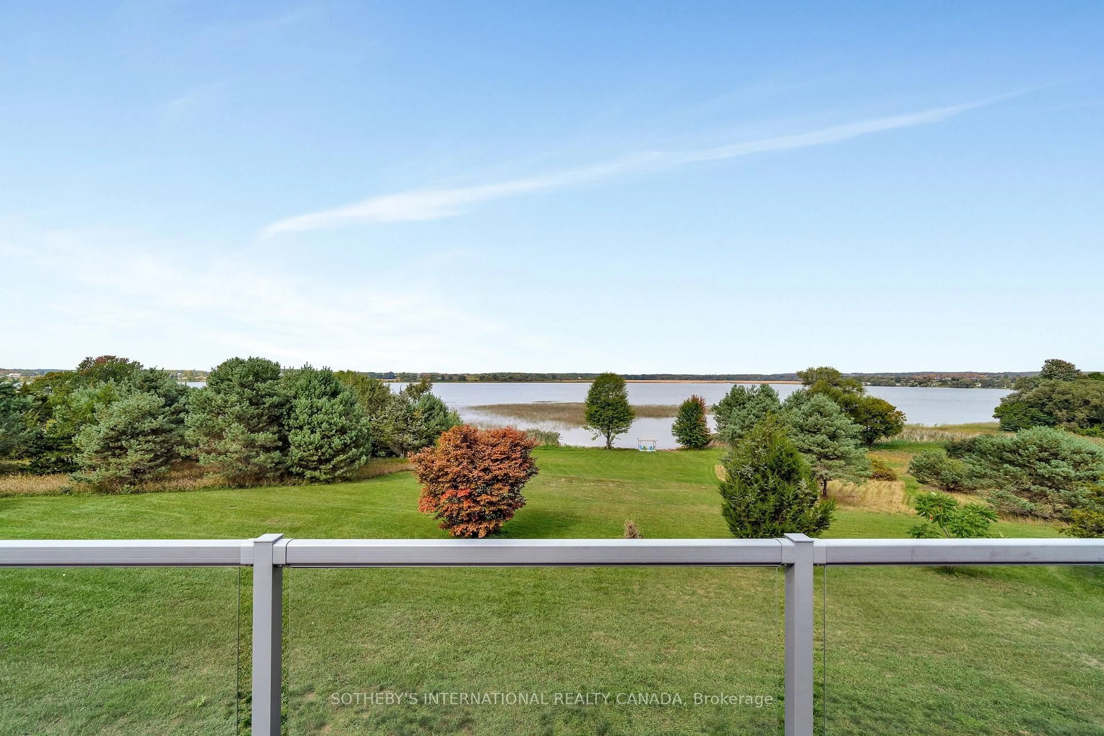 A pic from outside/outdoor area/front of a property/back of a property/a pic from drone, water/lake/river/ocean view for 188 County Road 18, Prince Edward County Ontario K0K 1P0