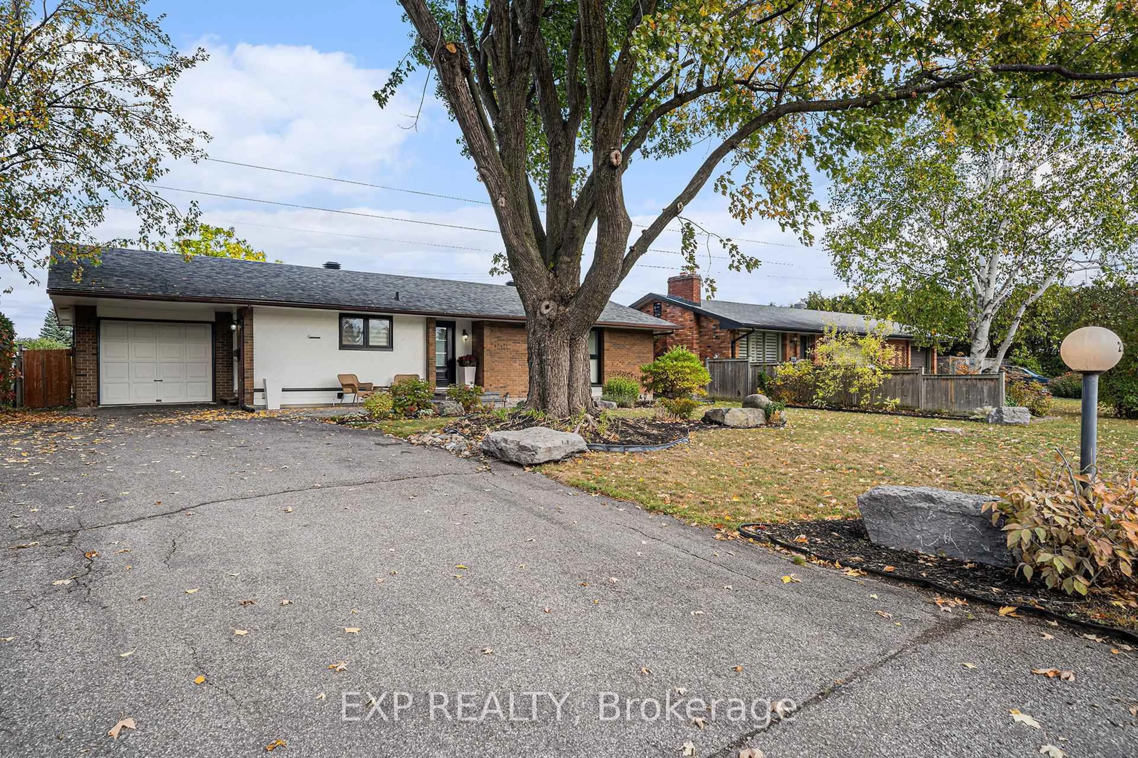 A pic from outside/outdoor area/front of a property/back of a property/a pic from drone, street for 203 Penfield Dr, Ottawa Ontario K2K 1M8