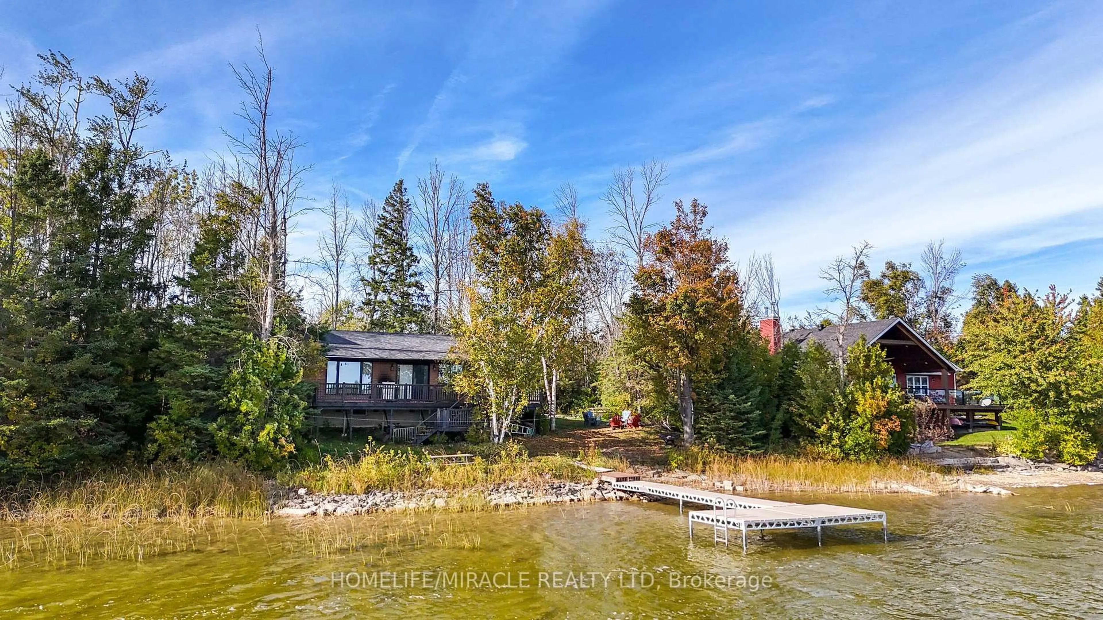 A pic from outside/outdoor area/front of a property/back of a property/a pic from drone, water/lake/river/ocean view for 68 Miller Lake Shore Rd, Northern Bruce Peninsula Ontario N0H 1Z0
