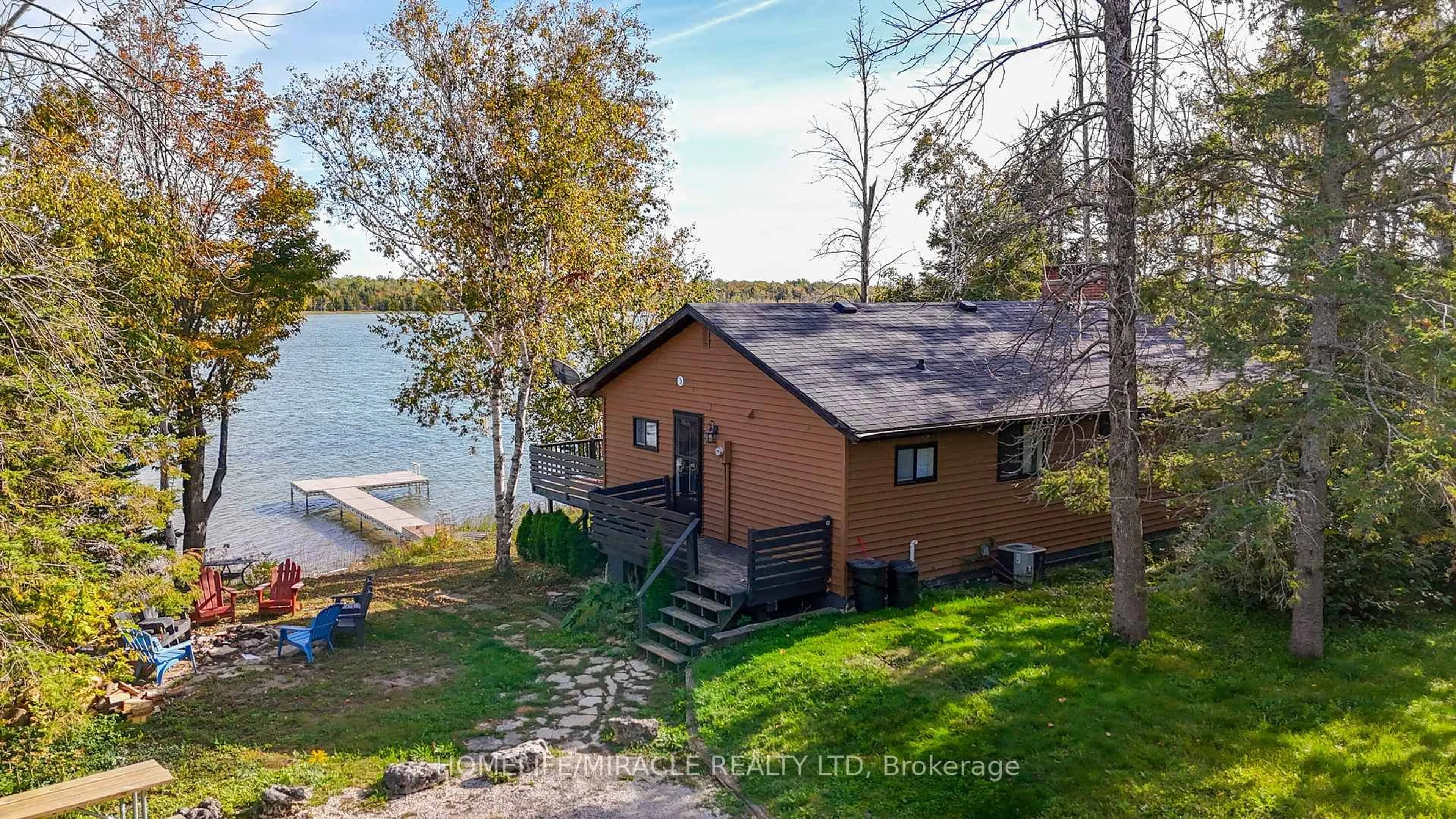 A pic from outside/outdoor area/front of a property/back of a property/a pic from drone, water/lake/river/ocean view for 68 Miller Lake Shore Rd, Northern Bruce Peninsula Ontario N0H 1Z0