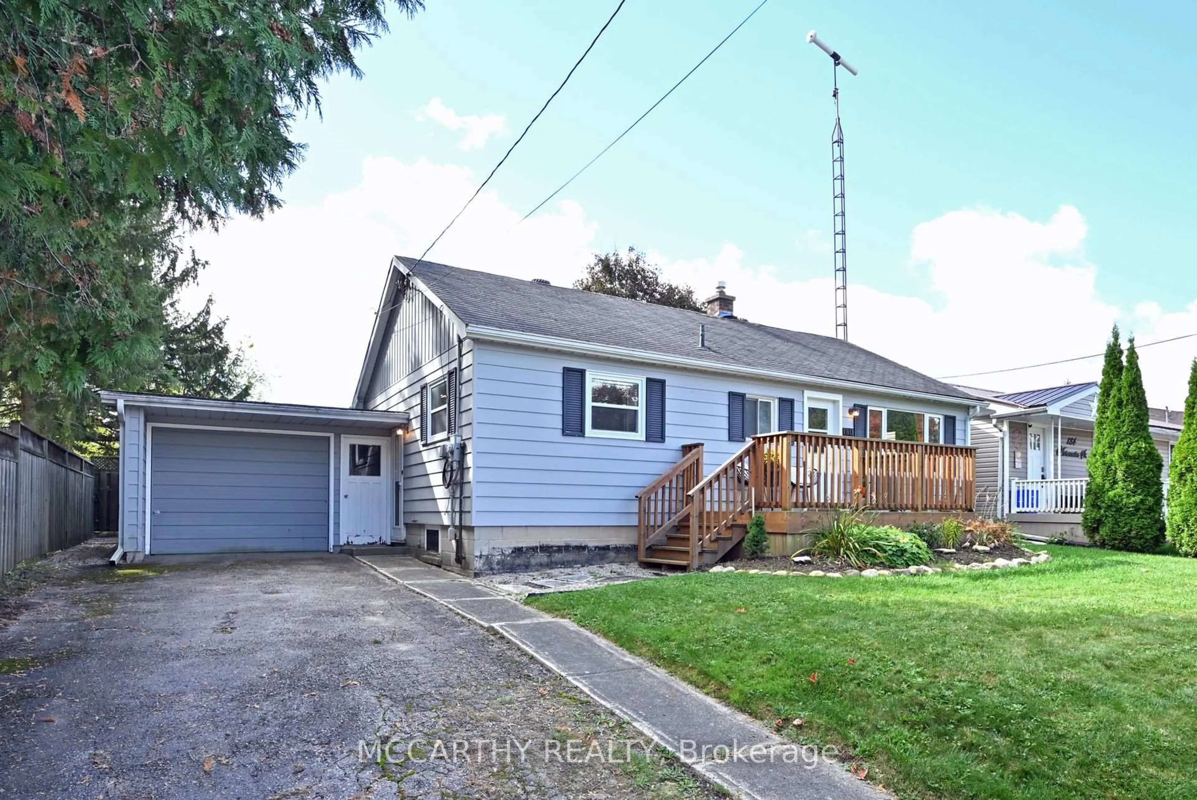 Home with vinyl exterior material, street for 180 Artemesia  St, Southgate Ontario N0C 1B0