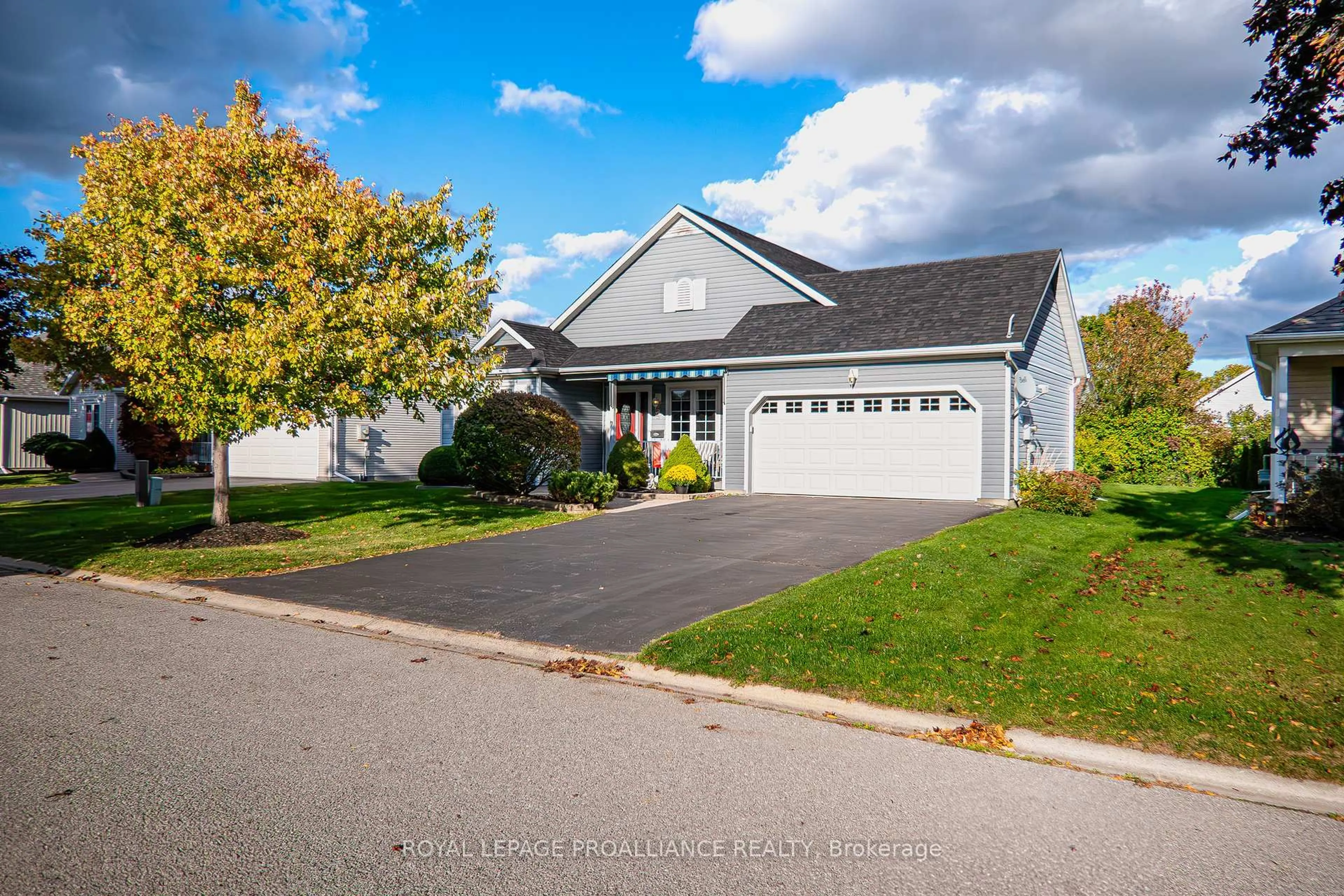 Home with vinyl exterior material, street for 7 Nesbitt Dr, Brighton Ontario K0K 1H0