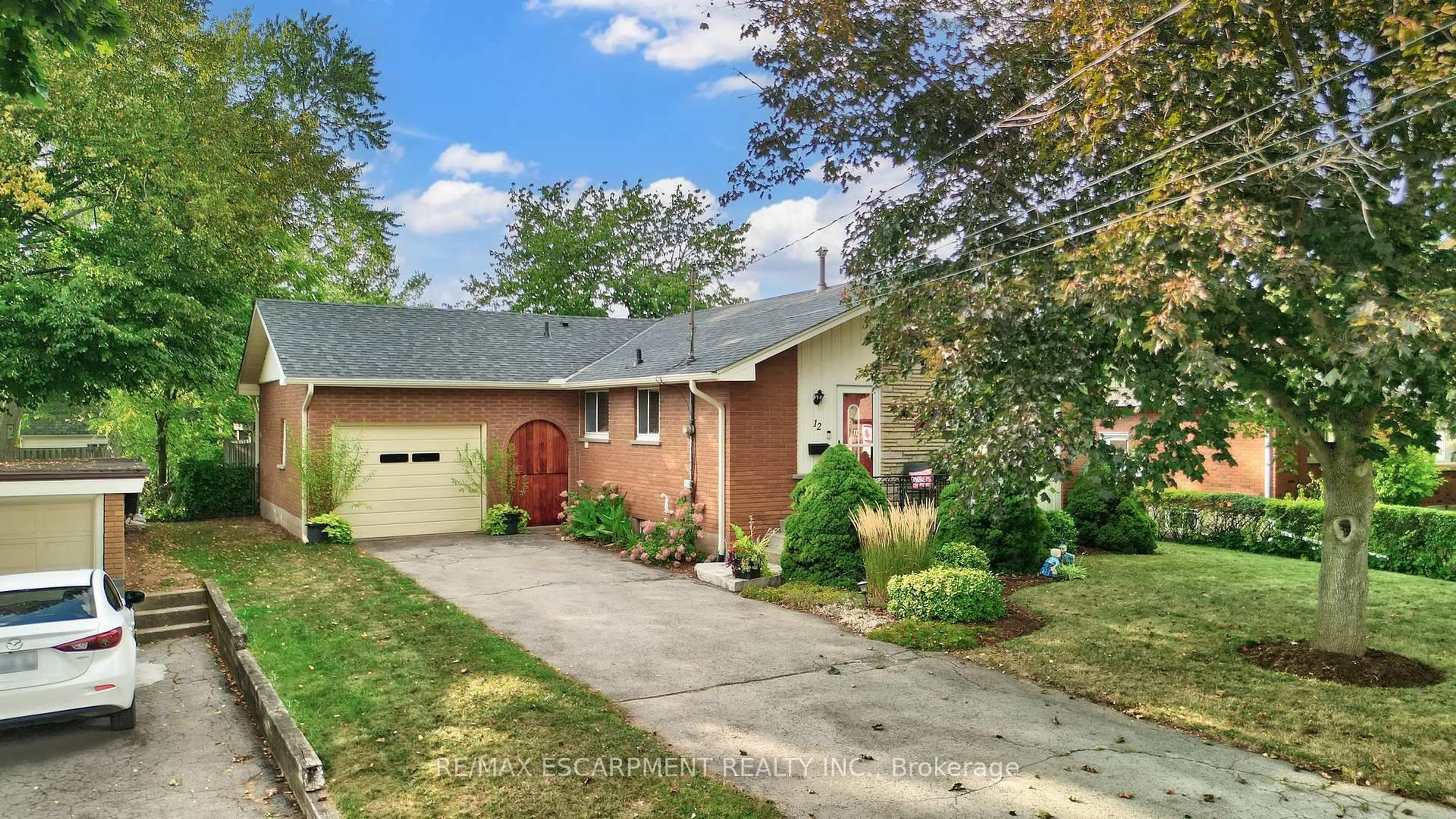Home with brick exterior material, street for 12 Geddes St, Grimsby Ontario L3M 1J4