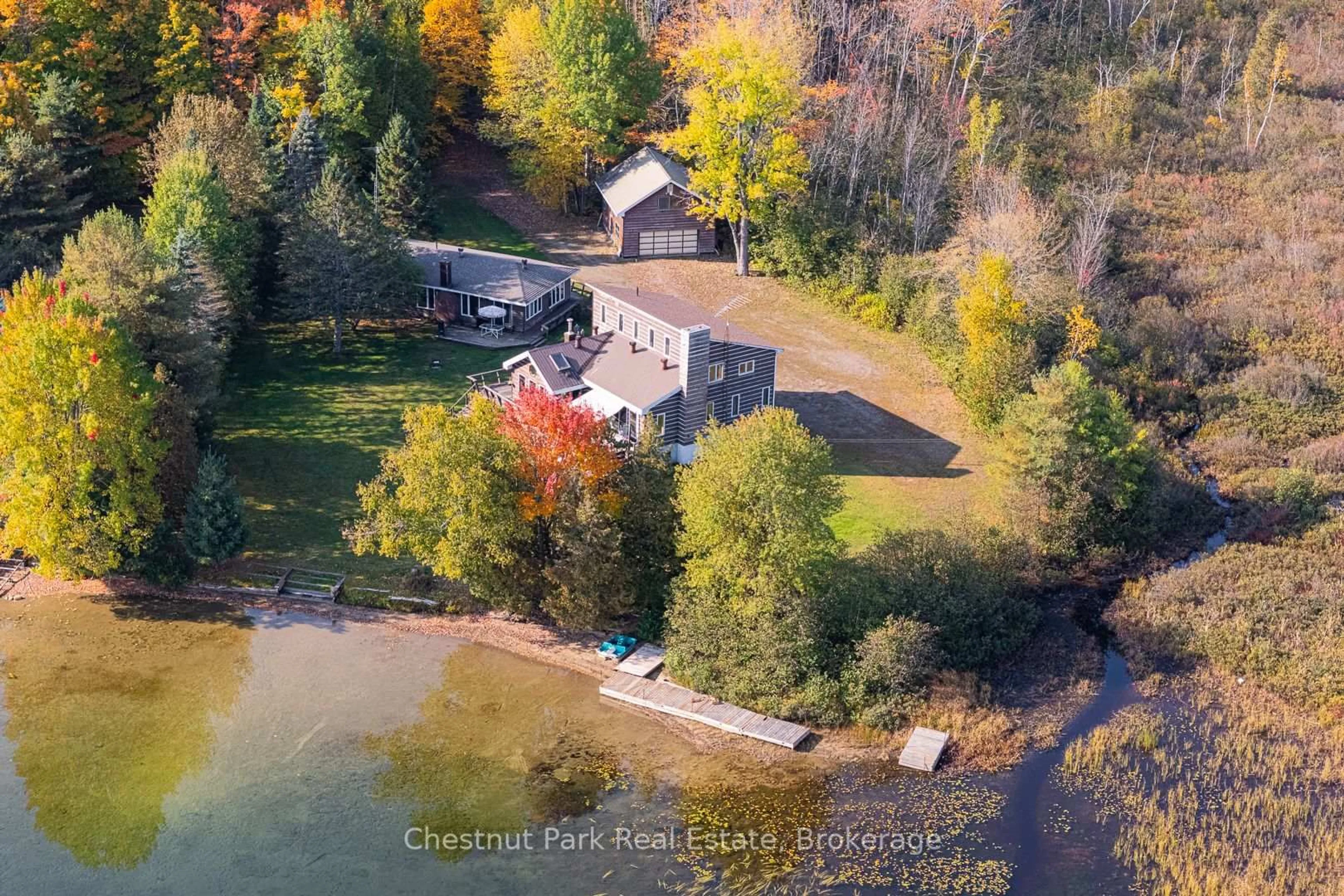 A pic from outside/outdoor area/front of a property/back of a property/a pic from drone, water/lake/river/ocean view for 170 Long Point Rd, Huntsville Ontario P0B 1M0