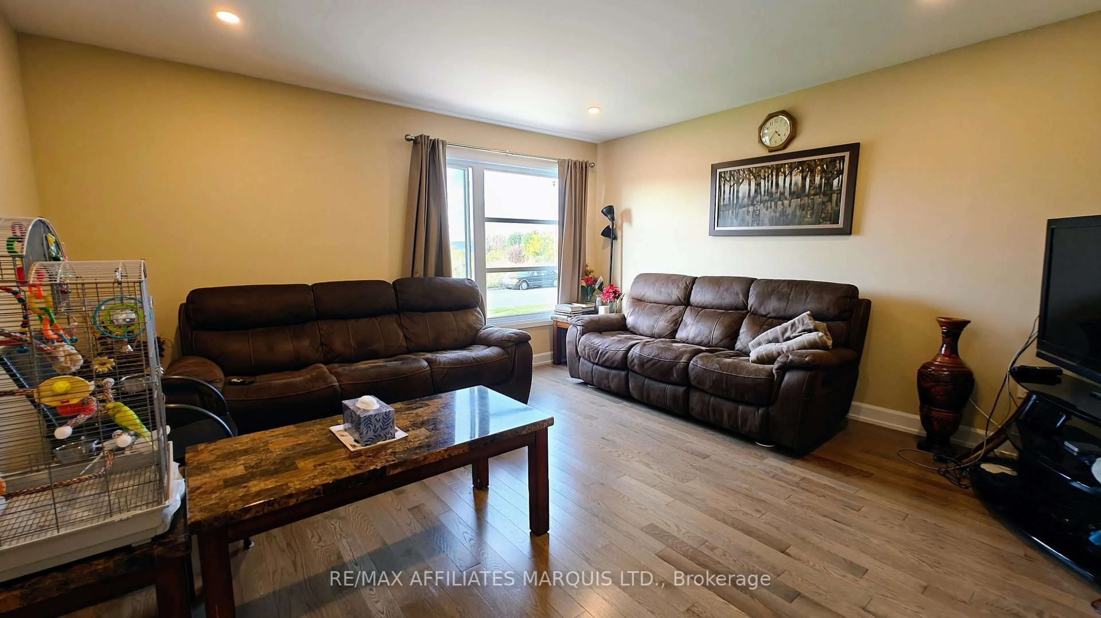 Living room with furniture, wood/laminate floor for 369 Belfort Cres, Cornwall Ontario K6H 0H4