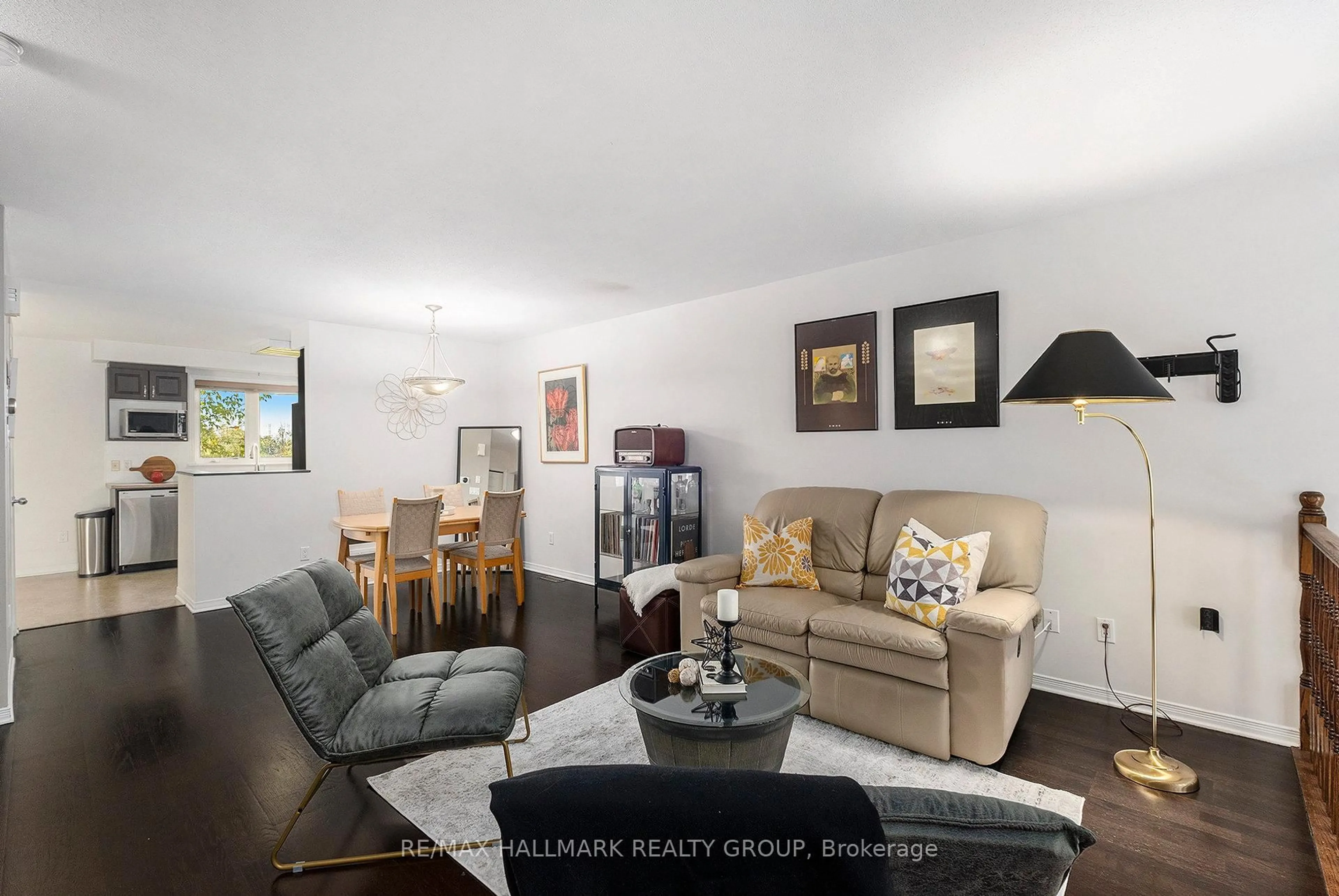Living room with furniture, wood/laminate floor for 1512 Walkley Rd #112, Ottawa Ontario K1V 2G5