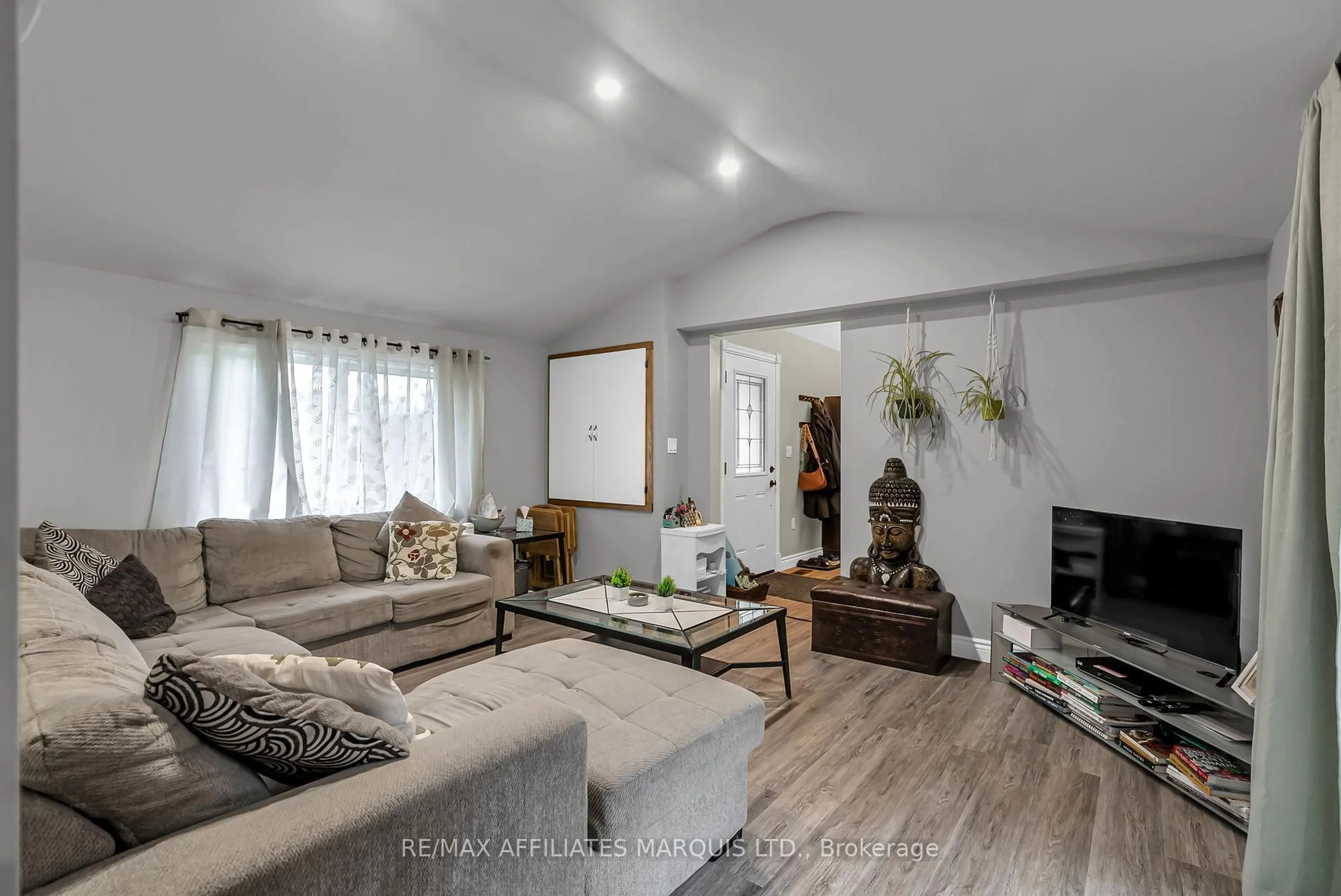 Living room with furniture, wood/laminate floor for 21895 Seguin Mill St, North Glengarry Ontario K0B 1H0