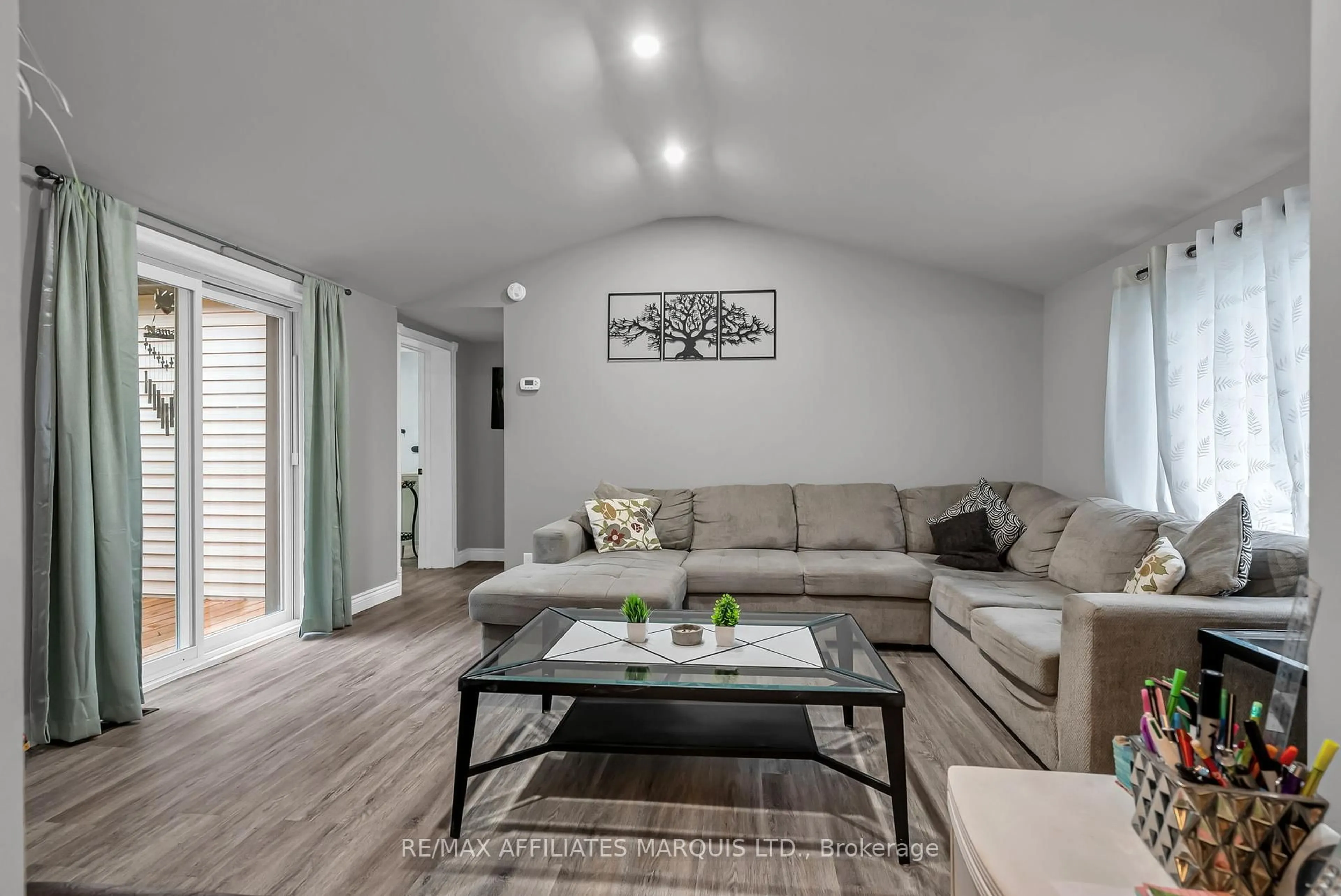 Living room with furniture, wood/laminate floor for 21895 Seguin Mill St, North Glengarry Ontario K0B 1H0