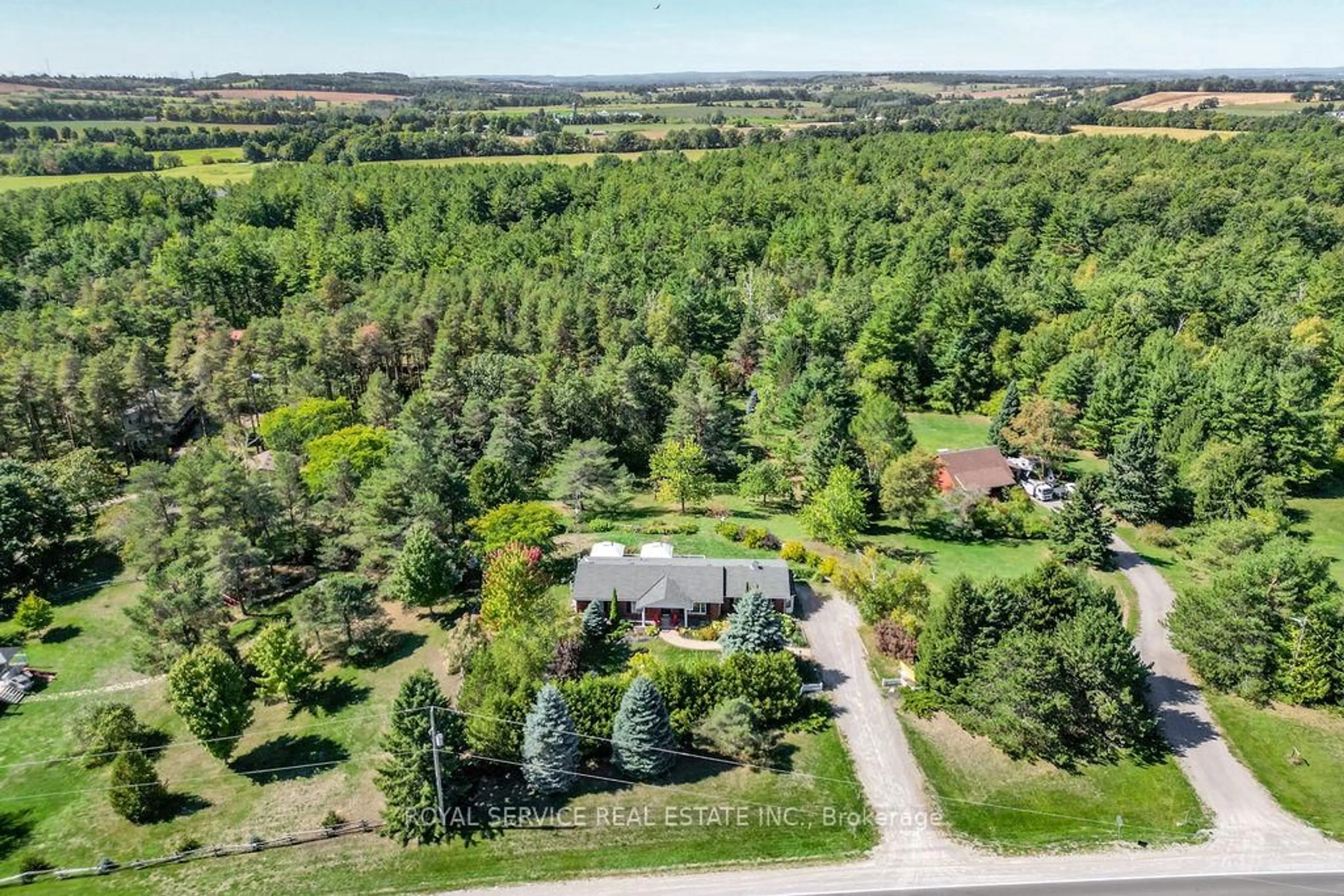 A pic from outside/outdoor area/front of a property/back of a property/a pic from drone, forest/trees view for 4470 Harwood Rd, Hamilton Township Ontario K0K 2E0