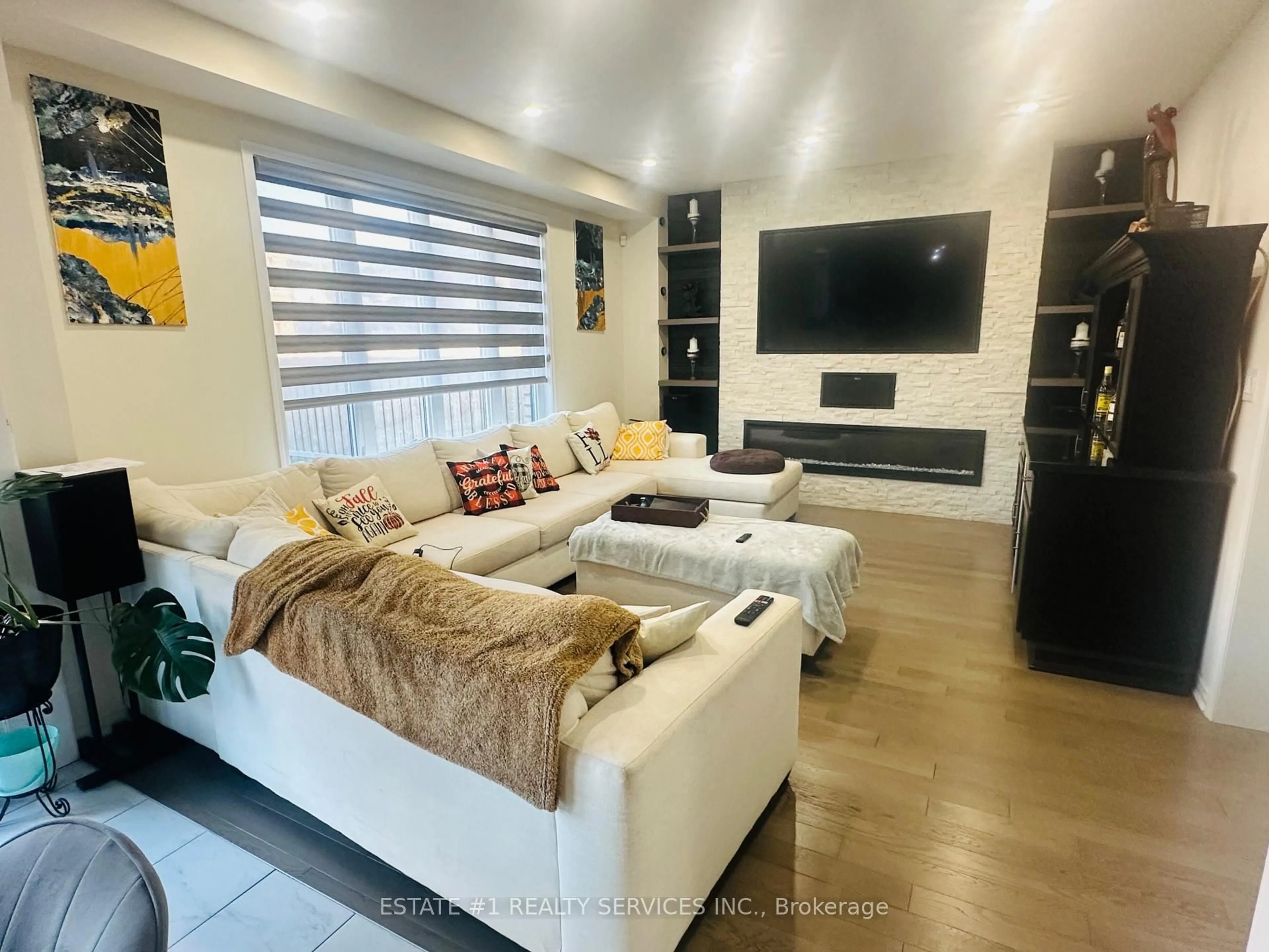 Living room with furniture, wood/laminate floor for 59 July Ave, Hamilton Ontario L8J 0M4
