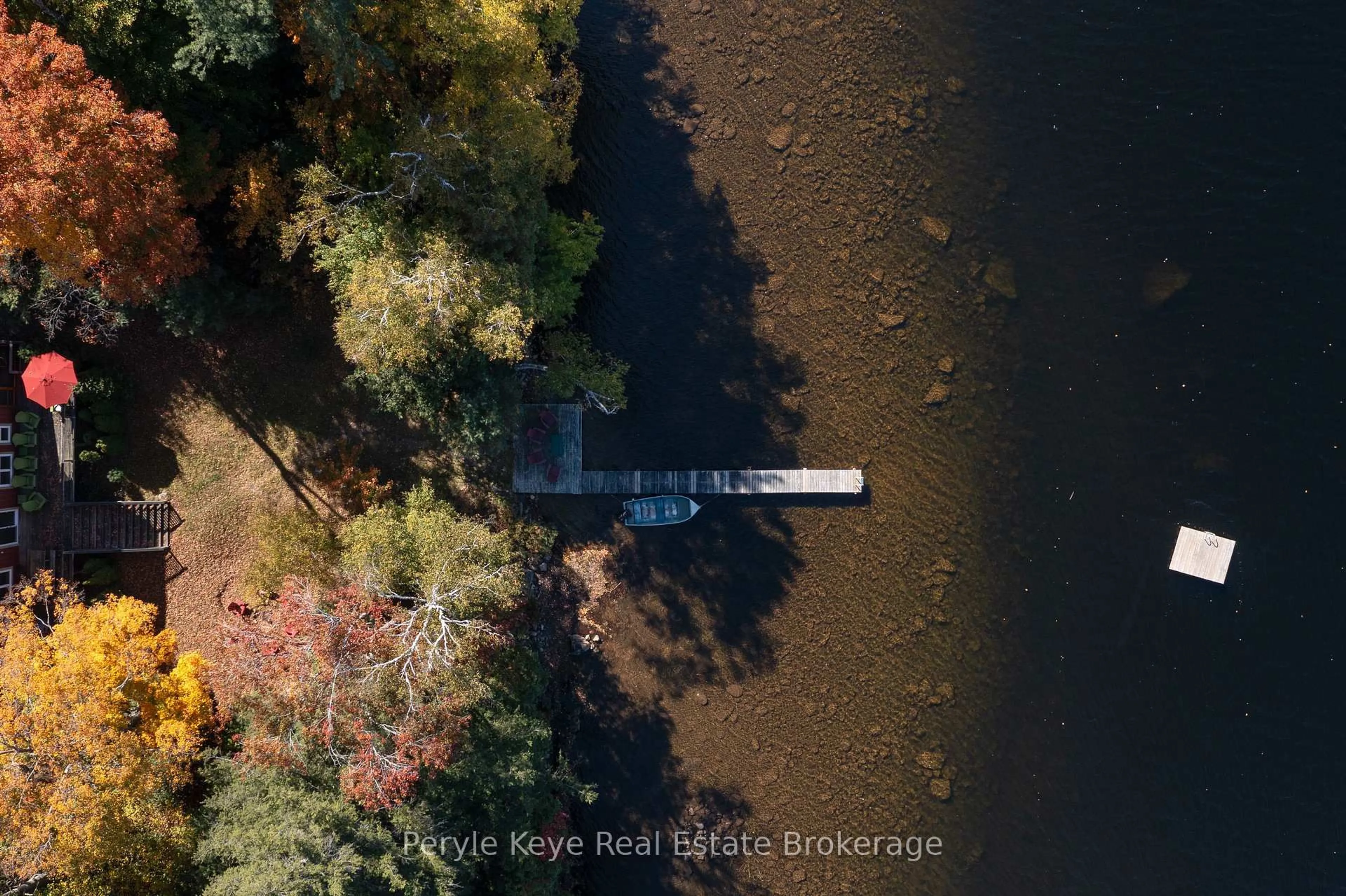 A pic from outside/outdoor area/front of a property/back of a property/a pic from drone, water/lake/river/ocean view for 1127 Whispering Pines Tr, Bracebridge Ontario P0H 0A9
