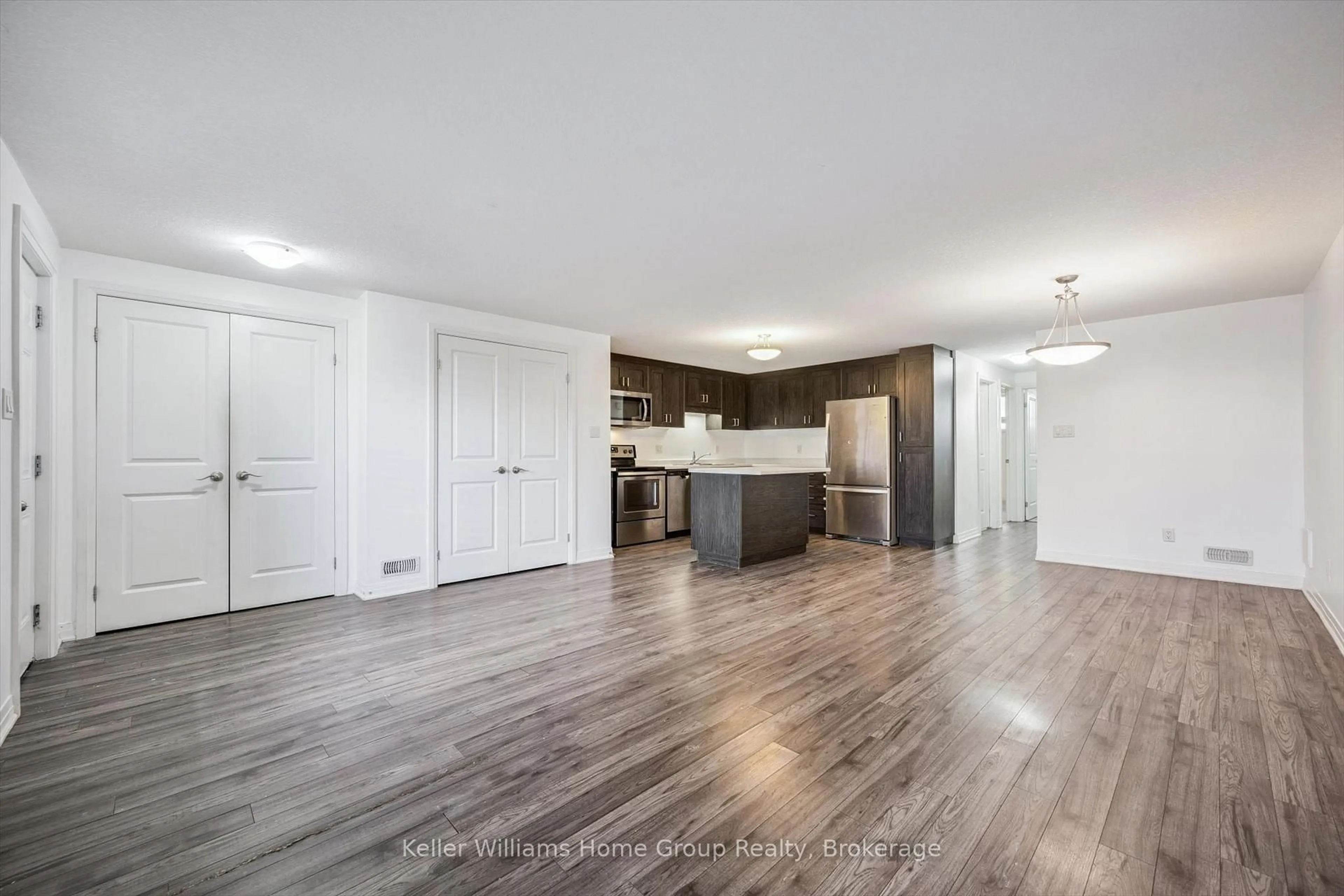 Open concept kitchen, wood/laminate floor for 1989 Ottawa St #66H, Kitchener Ontario N2E 0G7