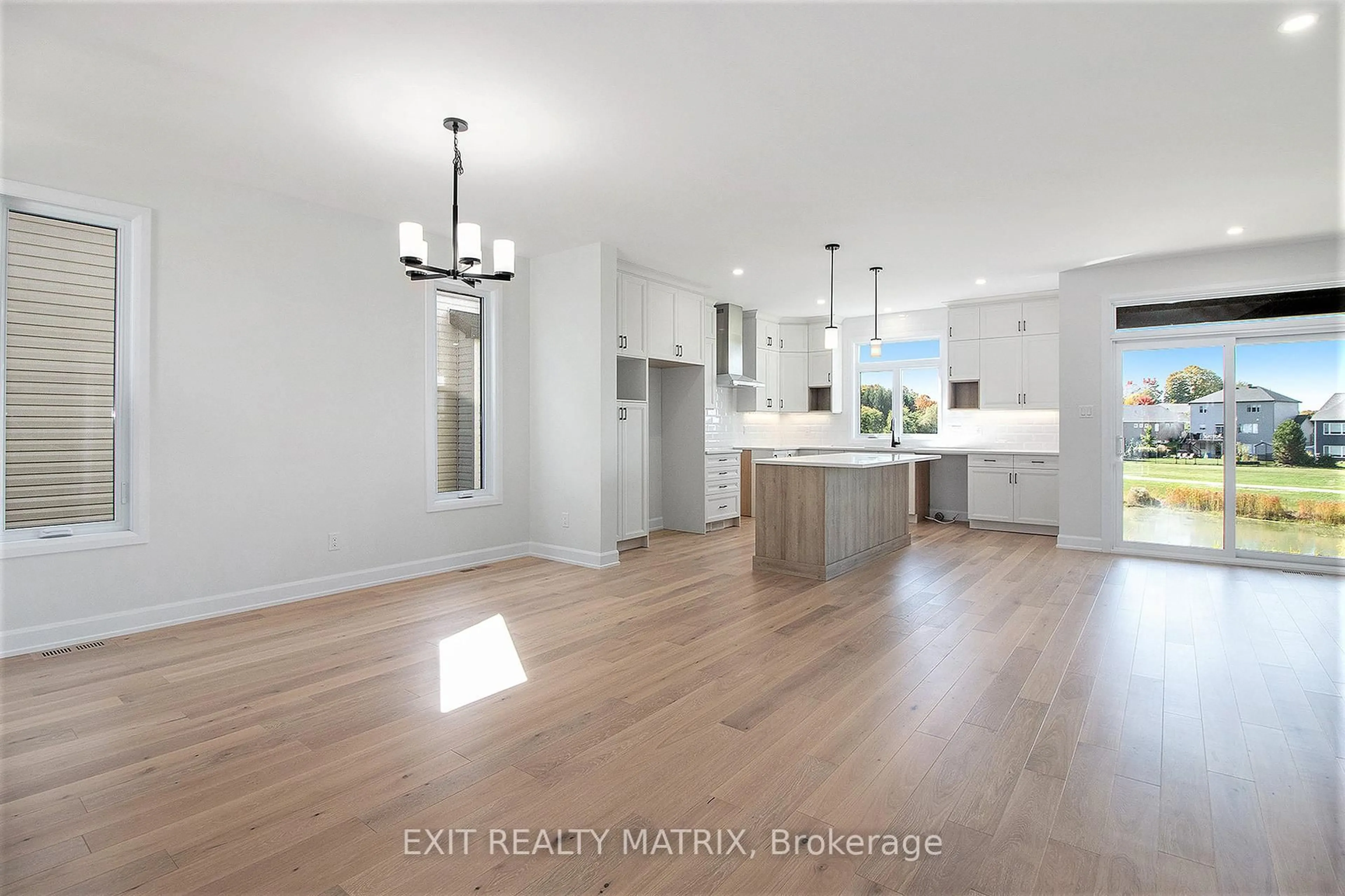 Open concept kitchen, wood/laminate floor for 1311 Fribourg St, Russell Ontario K0A 1W0