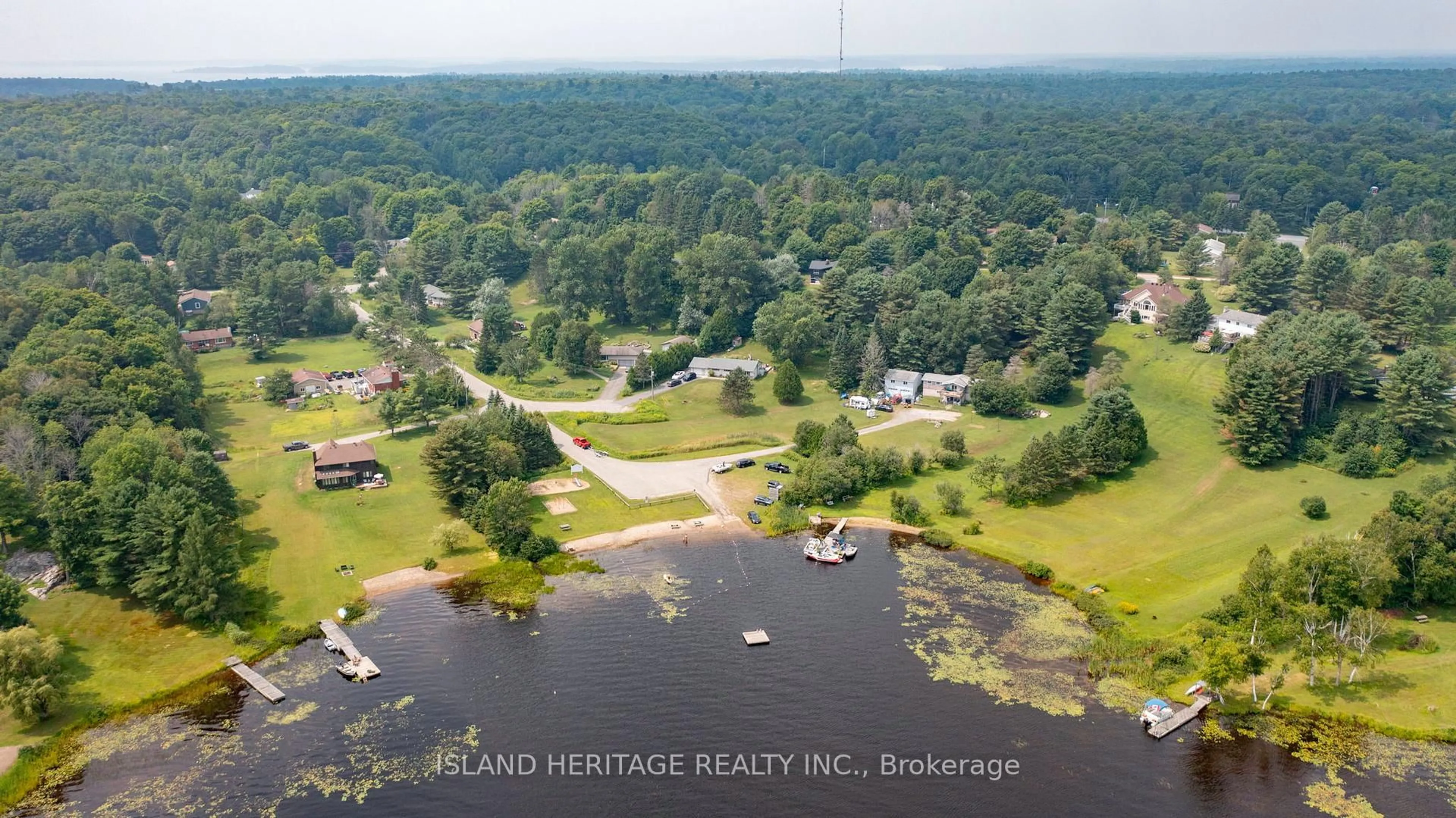 A pic from outside/outdoor area/front of a property/back of a property/a pic from drone, water/lake/river/ocean view for 5 Linney Lane, McDougall Ontario P2A 2W9