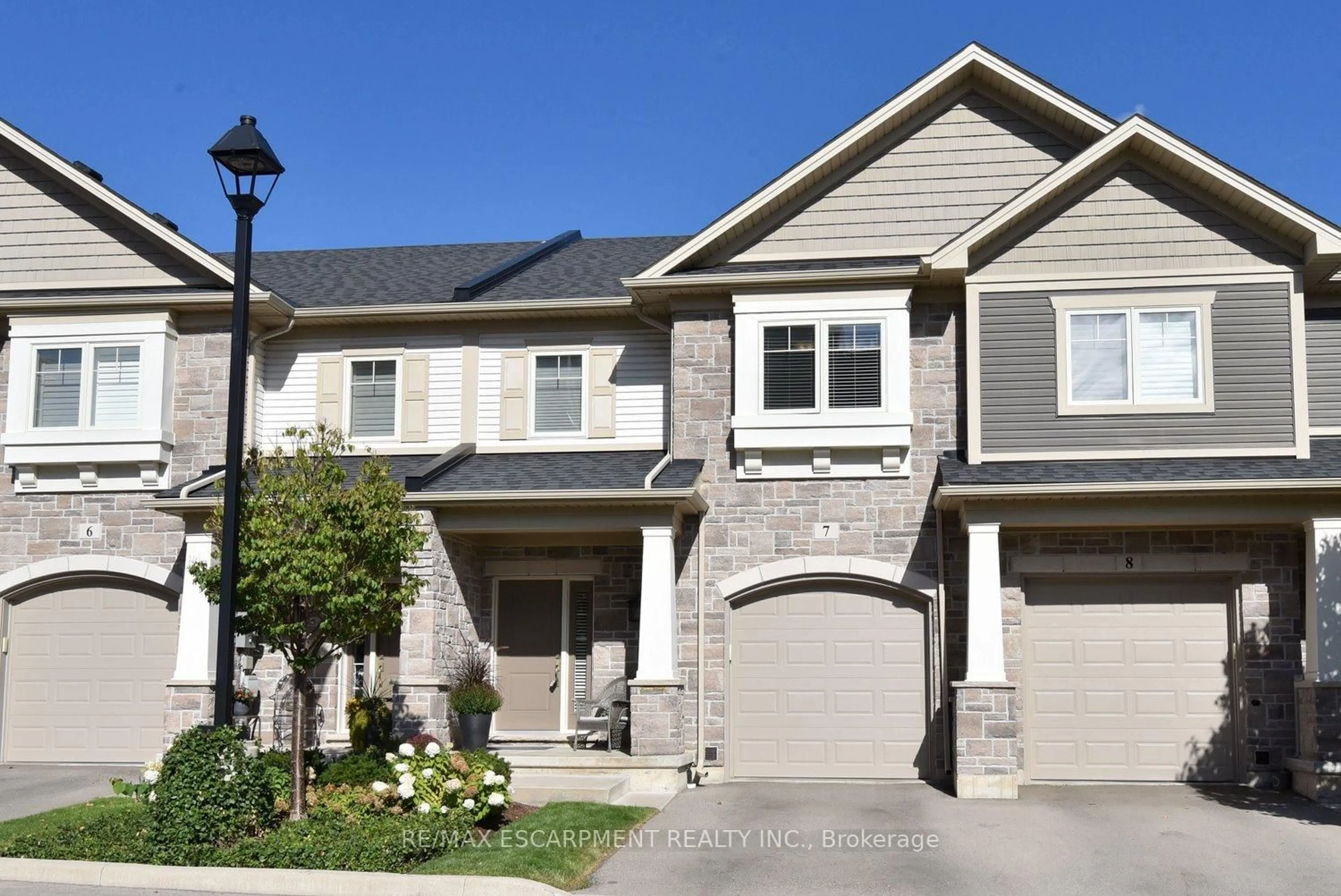 Home with brick exterior material, street for 40 Hamilton St #7, Hamilton Ontario L8B 1V8