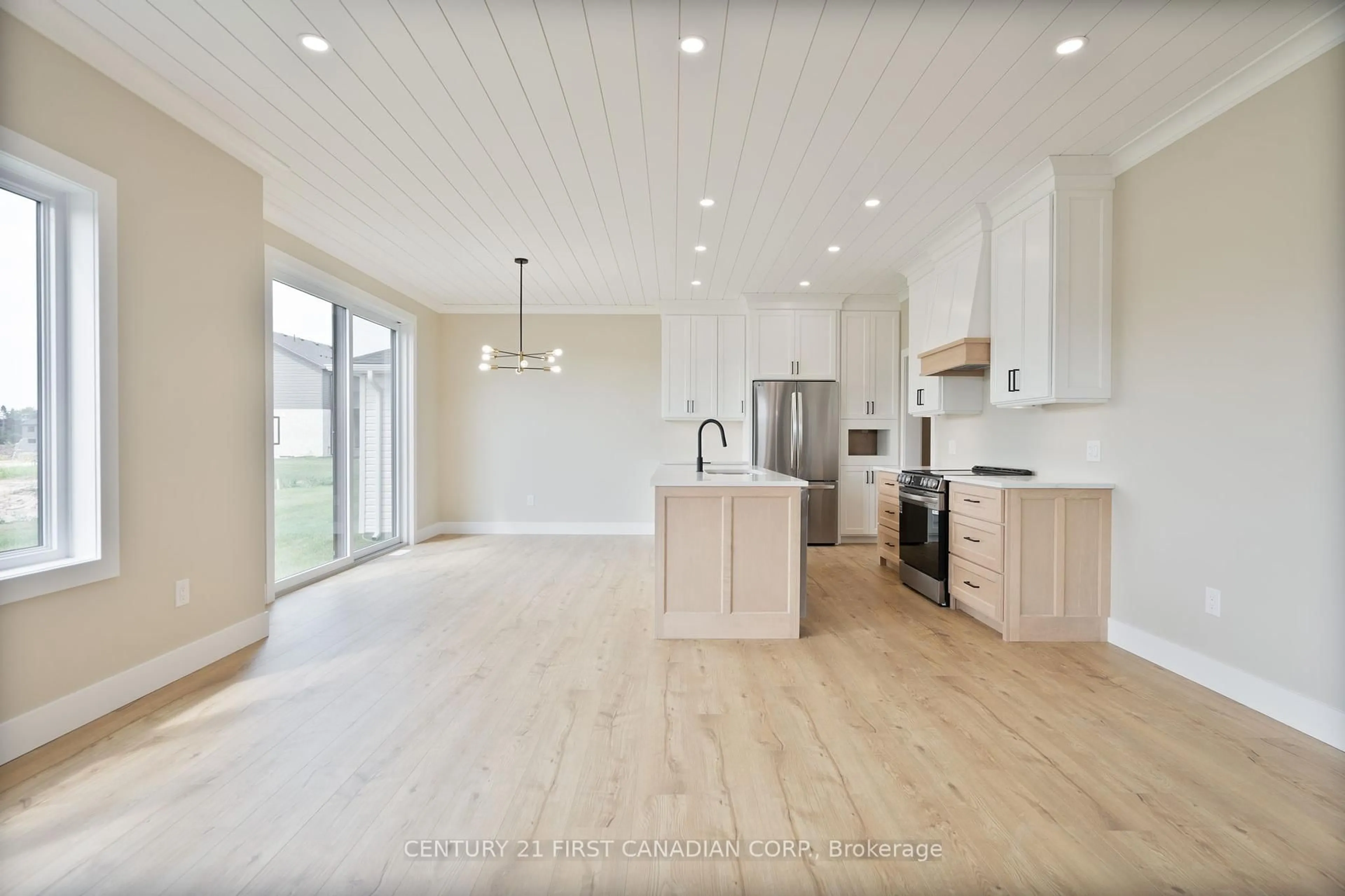 Open concept kitchen, wood/laminate floor for 25 Sheldabren St, North Middlesex Ontario N0M 1A0