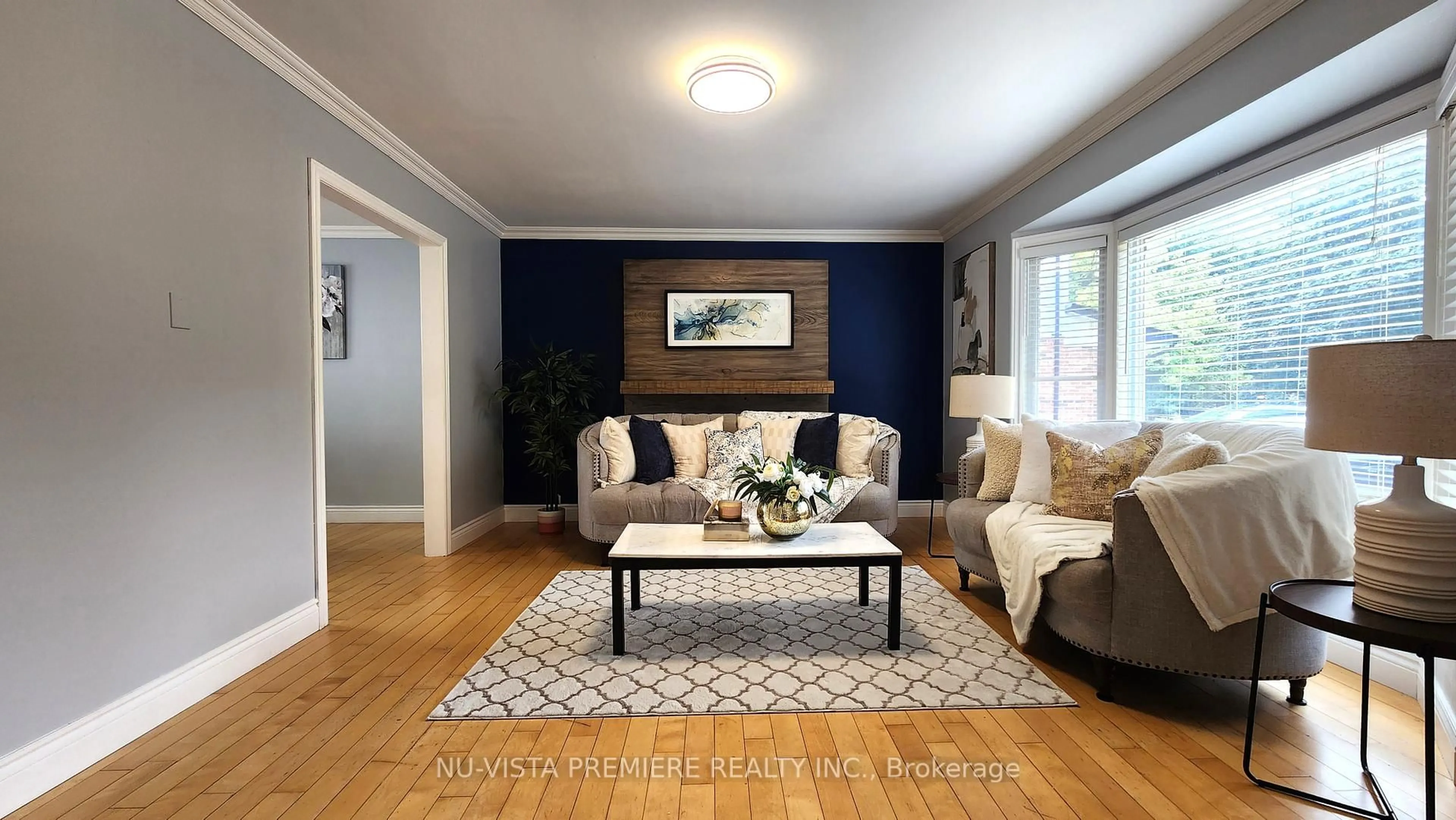 Living room with furniture, wood/laminate floor for 57 McTaggart Cres, London North Ontario N5X 2E2