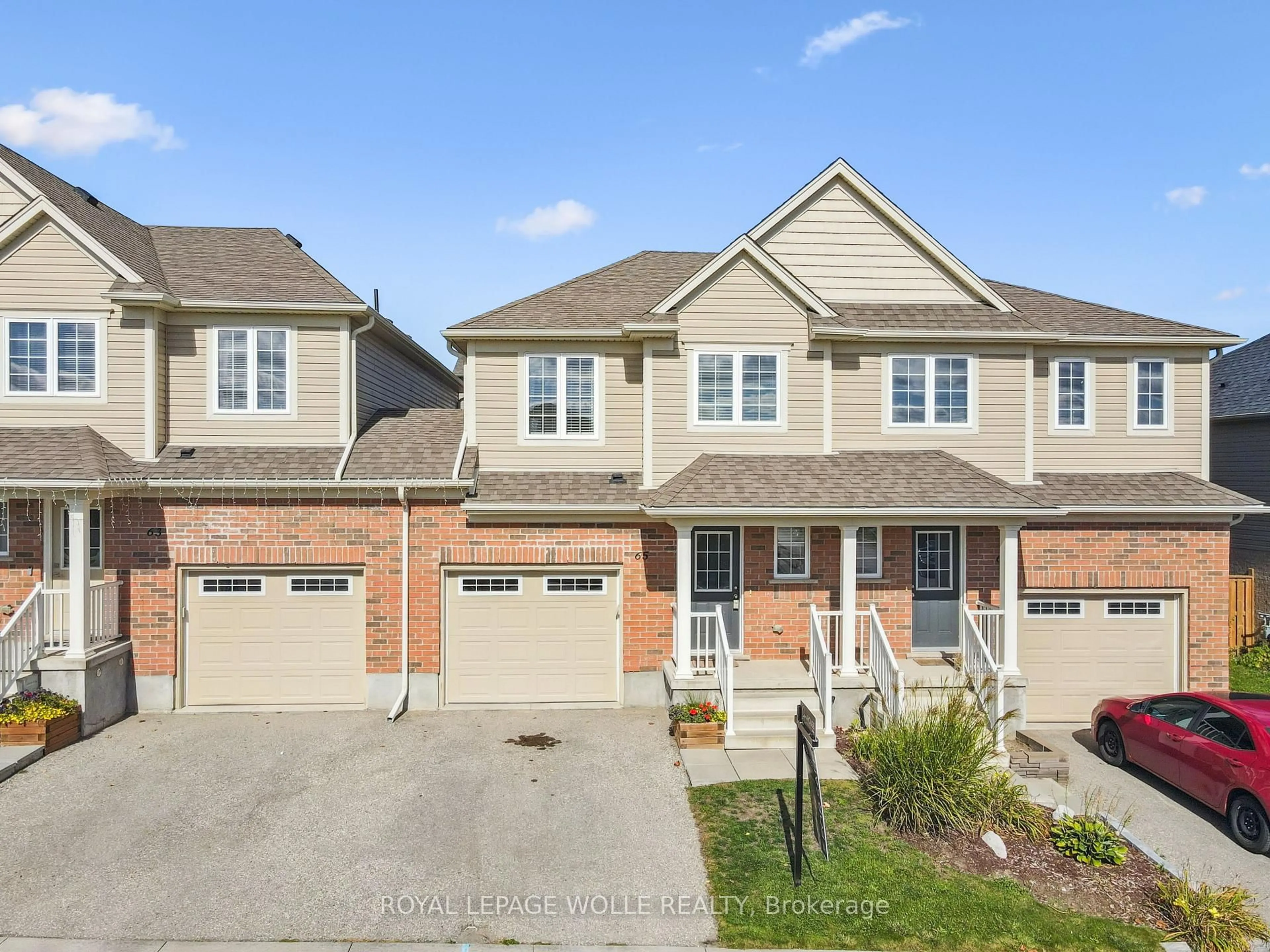 Home with brick exterior material, street for 65 Grand Flats Tr, Kitchener Ontario N2A 0J8