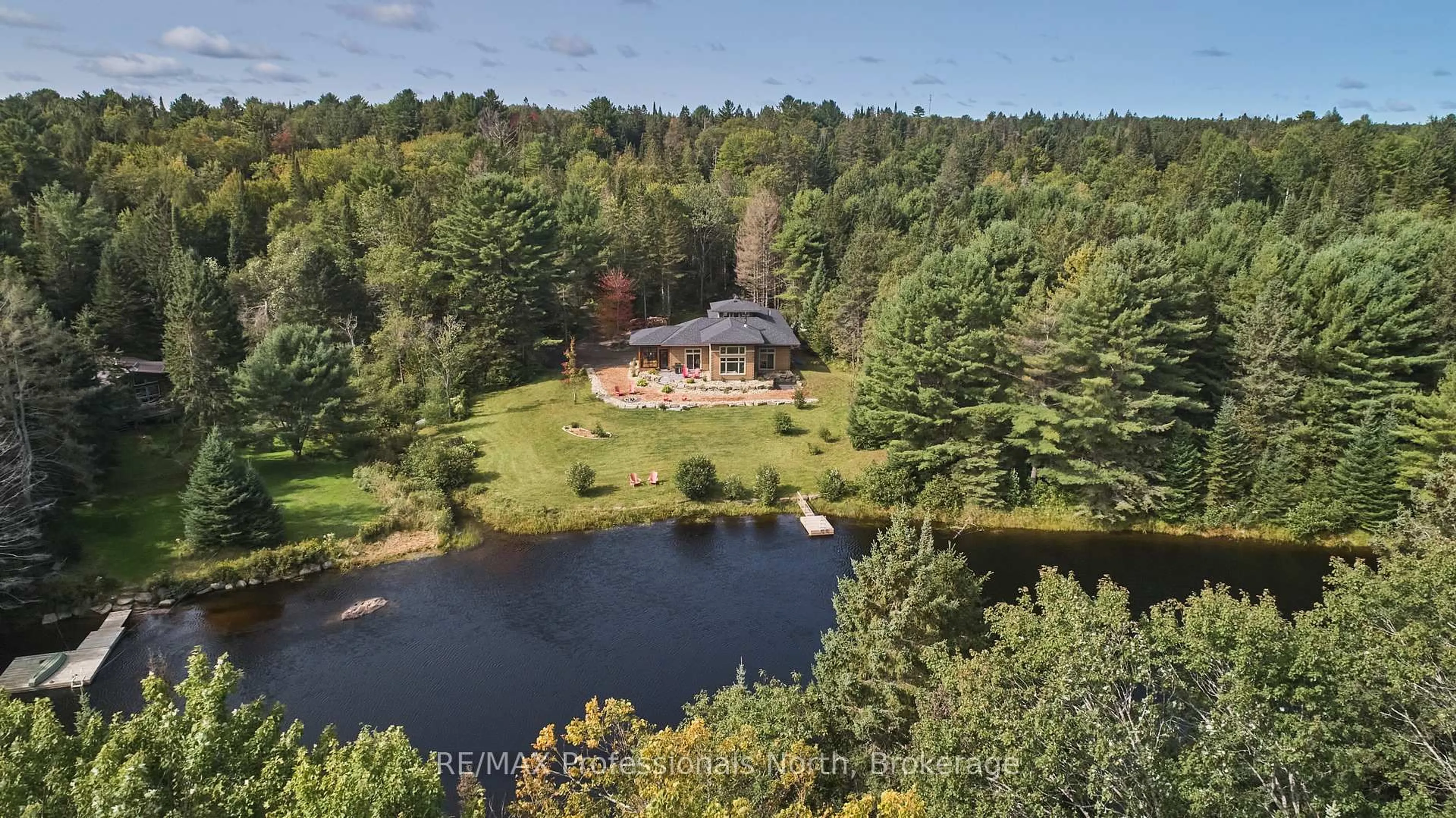 A pic from outside/outdoor area/front of a property/back of a property/a pic from drone, water/lake/river/ocean view for 203 Bonnell Rd, Bracebridge Ontario P1L 0M1