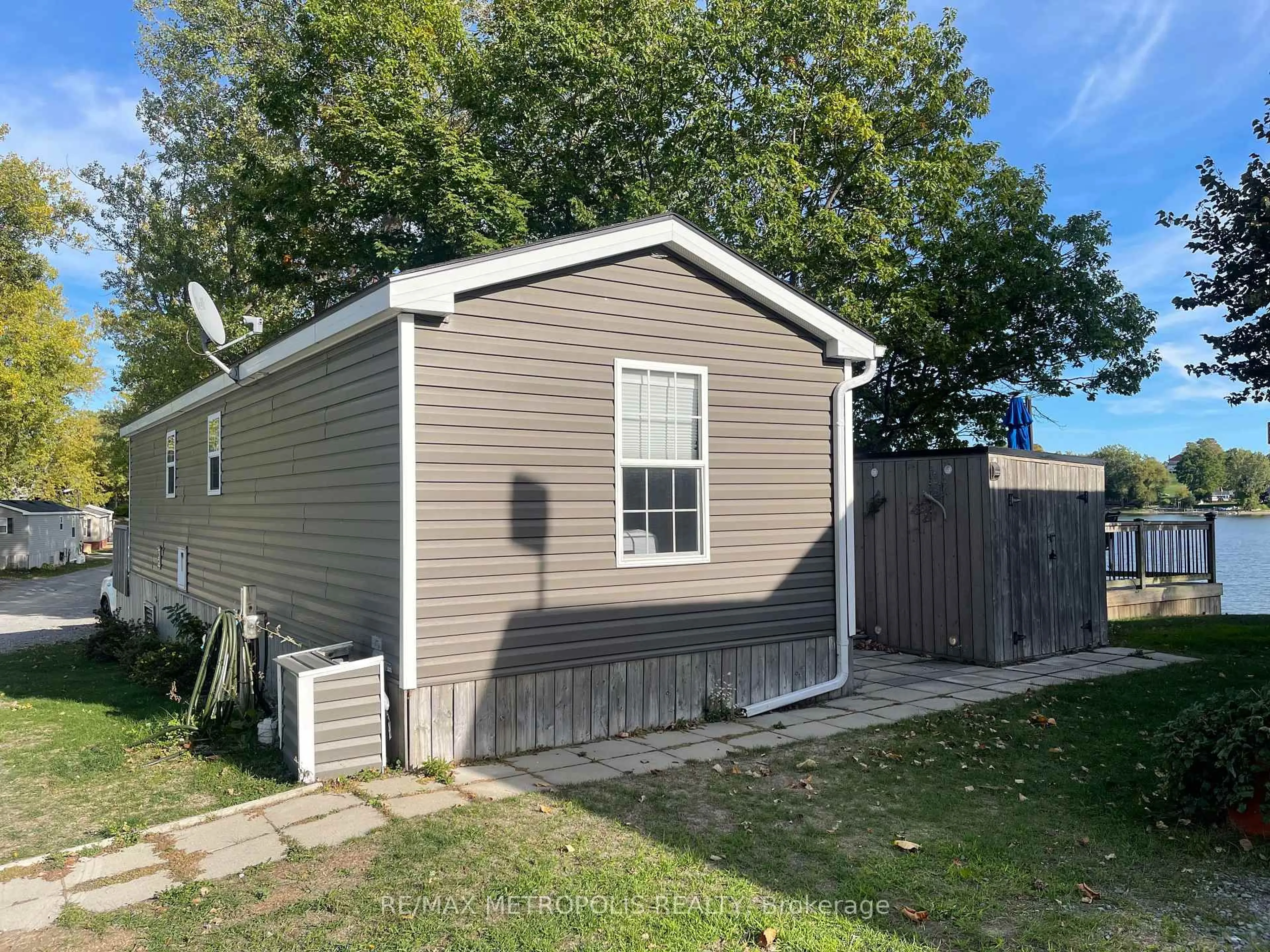 Home with vinyl exterior material, street for 486 Cty Cherry Beach Lane #18-73, Prince Edward County Ontario K0K 2P0