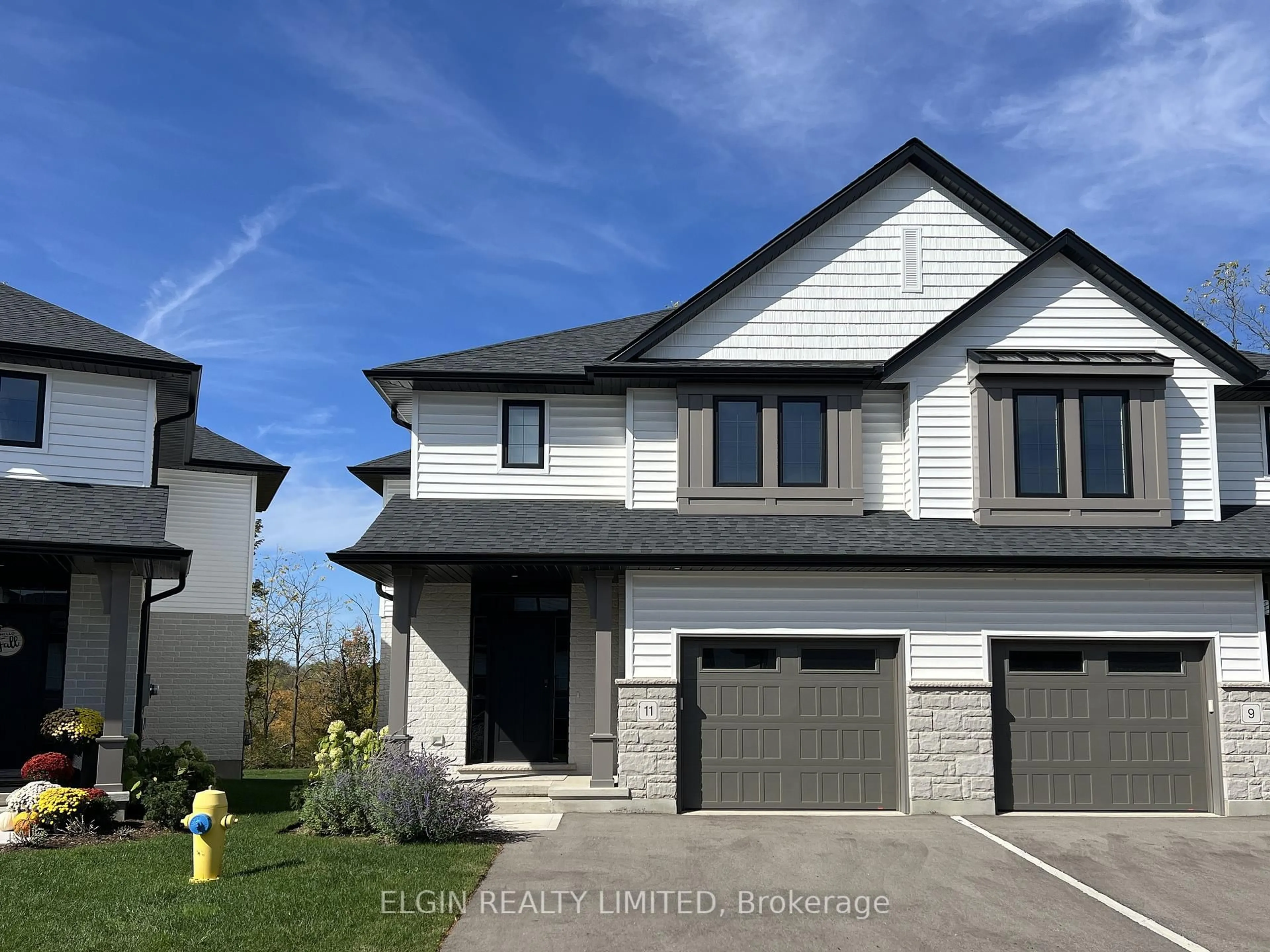 Home with vinyl exterior material, street for 11-49 Royal Dornoch Dr, St. Thomas Ontario N5R 0P4