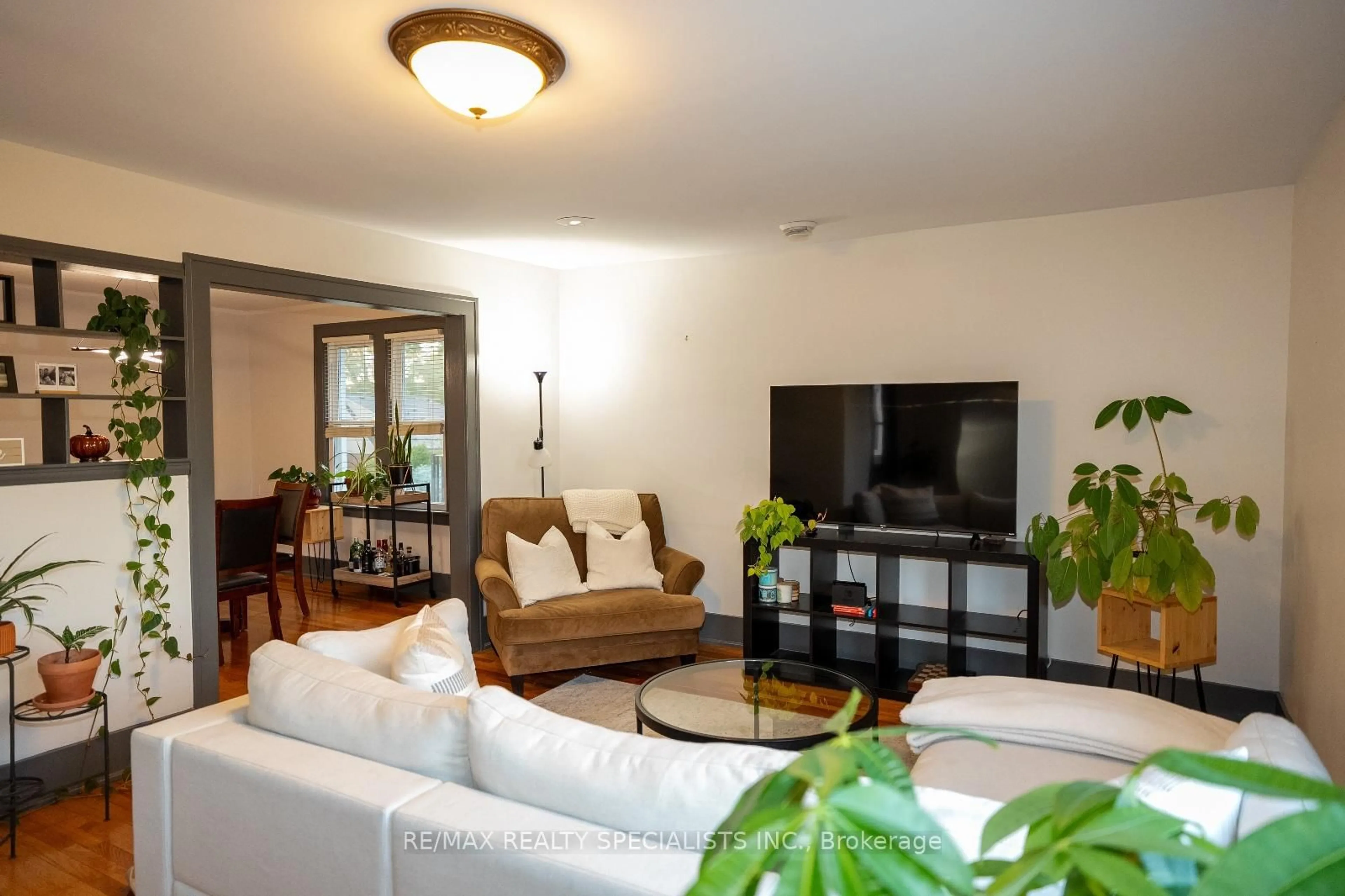 Living room with furniture, wood/laminate floor for 2371-2373 Lincoln Rd, Windsor Ontario N8W 2R4