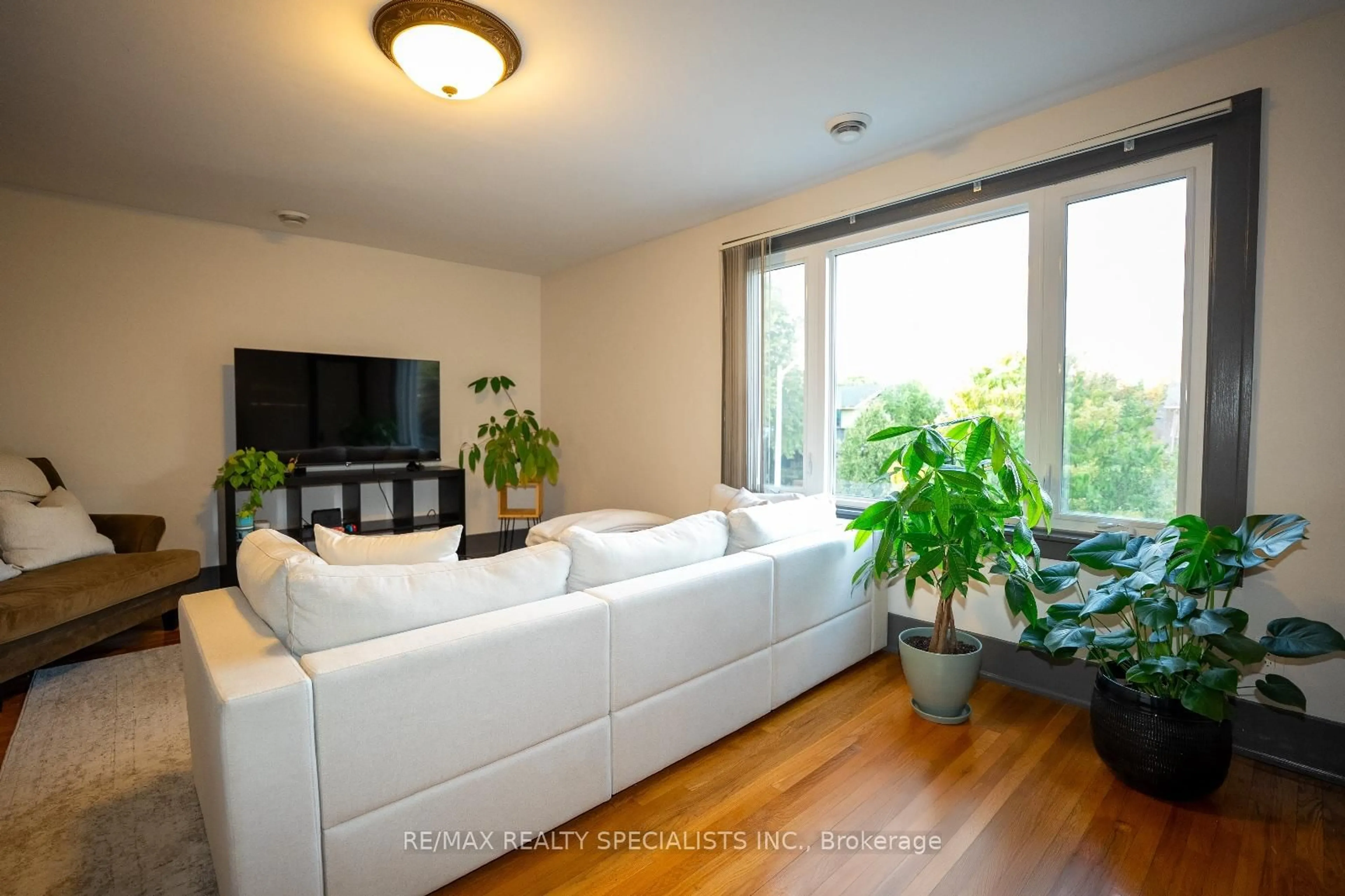 Living room with furniture, wood/laminate floor for 2371-2373 Lincoln Rd, Windsor Ontario N8W 2R4