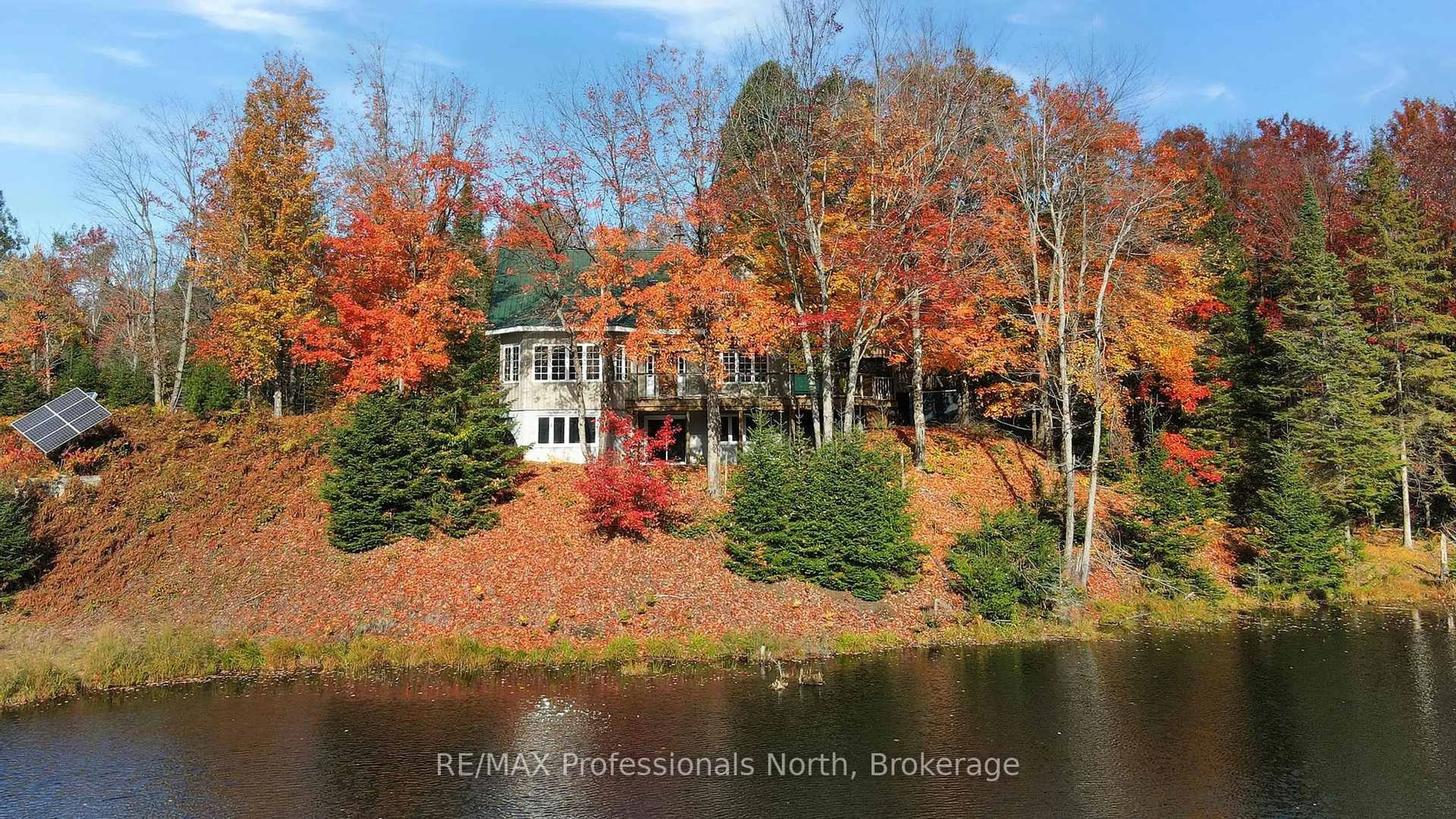 A pic from outside/outdoor area/front of a property/back of a property/a pic from drone, water/lake/river/ocean view for 1966 Bacon Rd, Minden Hills Ontario K0M 2A1