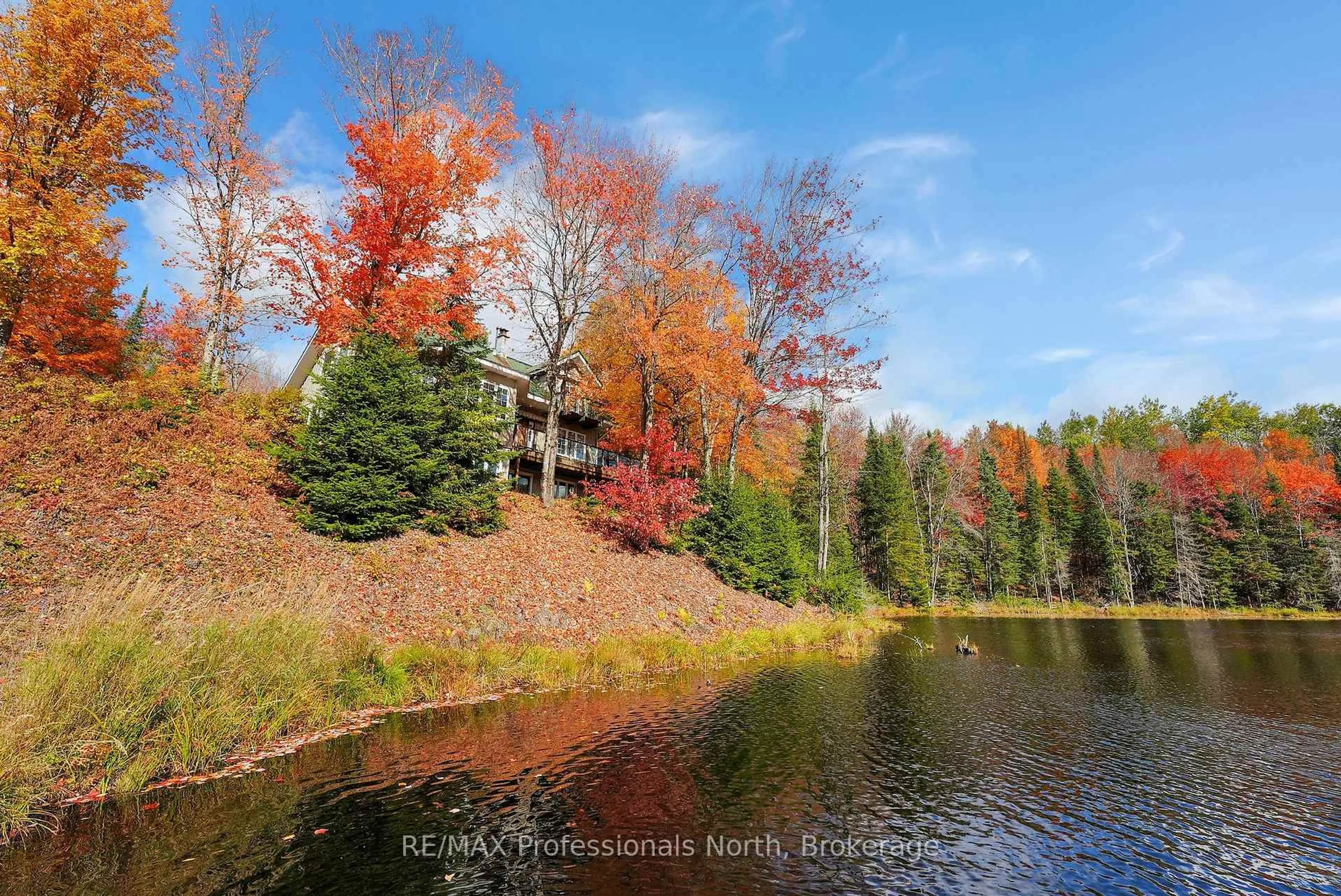 A pic from outside/outdoor area/front of a property/back of a property/a pic from drone, water/lake/river/ocean view for 1966 Bacon Rd, Minden Hills Ontario K0M 2A1