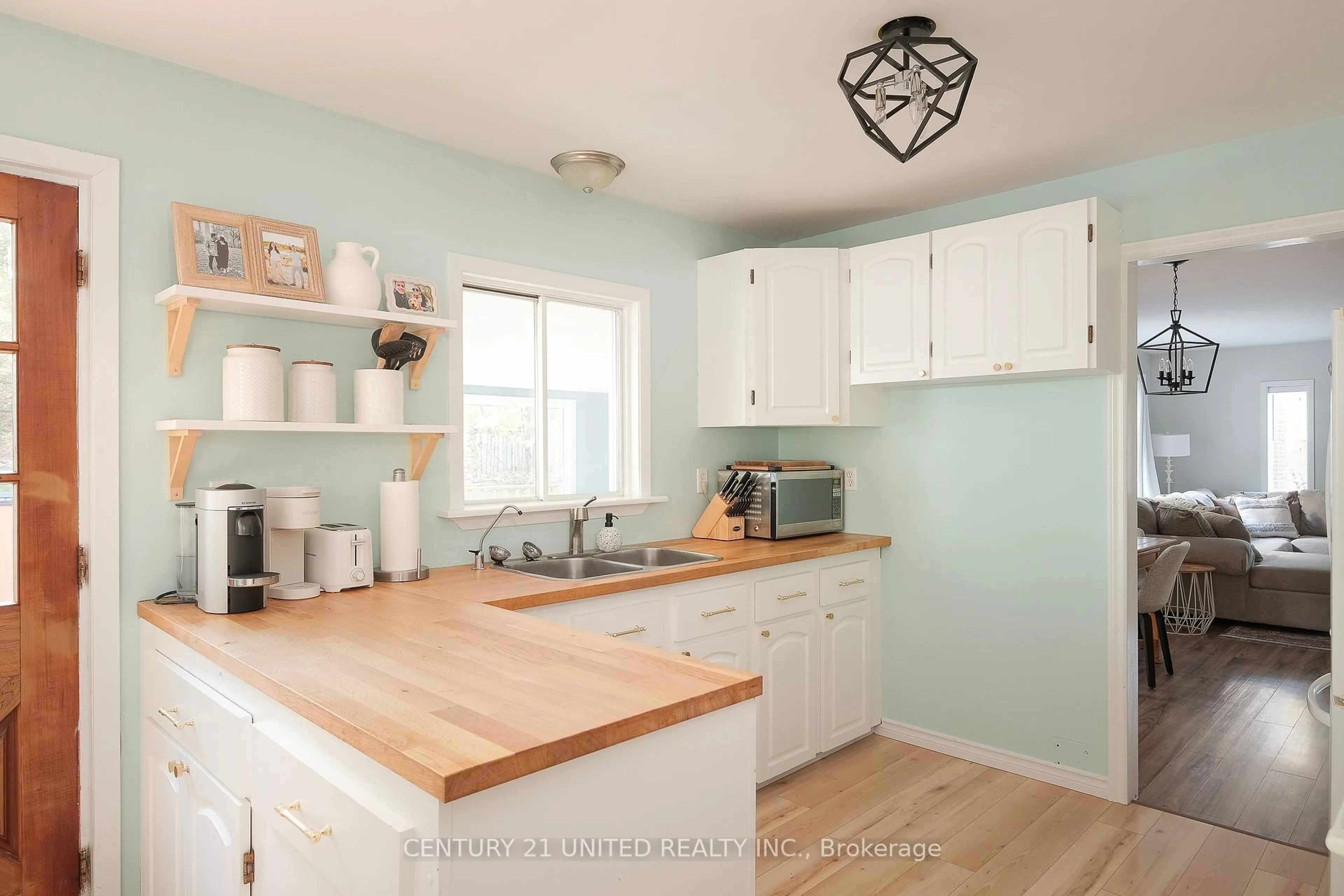Open concept kitchen, wood/laminate floor for 1274 Young's Cove Rd, Selwyn Ontario K0L 1T0