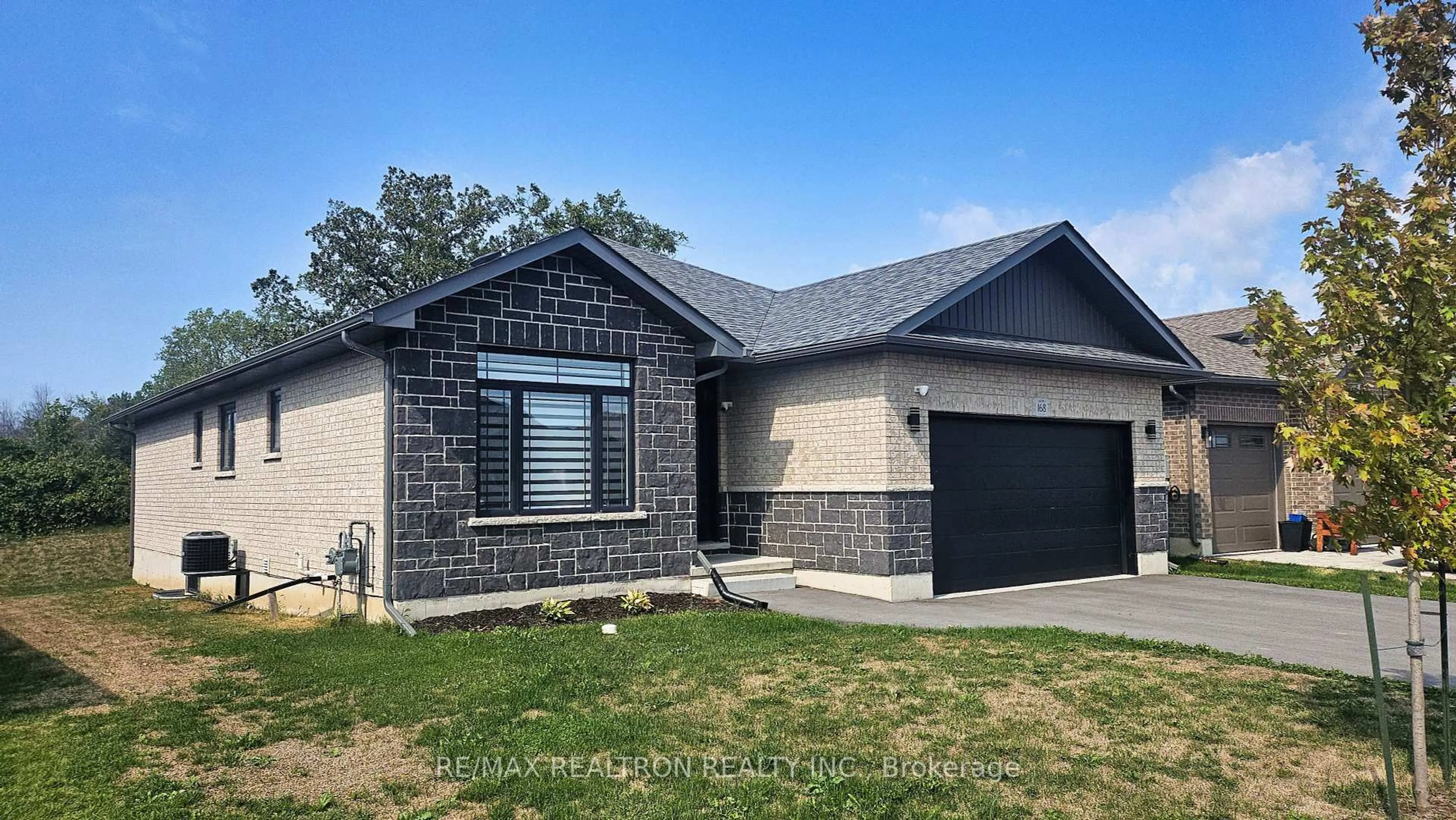Home with brick exterior material, street for 168 Cherrywood Pkwy, Greater Napanee Ontario K7R 0E2
