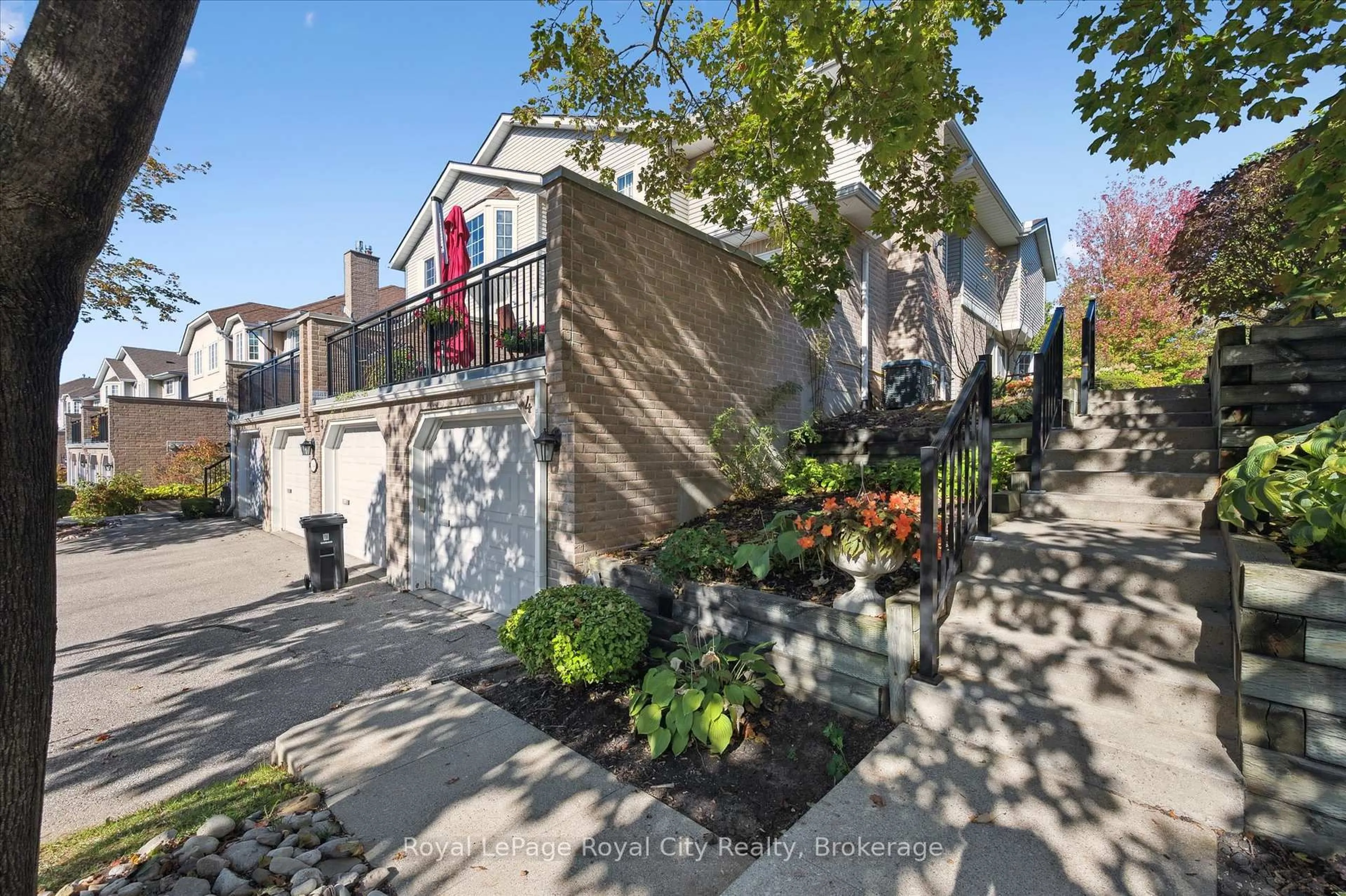 A pic from outside/outdoor area/front of a property/back of a property/a pic from drone, street for 104 Woodlawn Rd #3, Guelph Ontario N1E 1B7