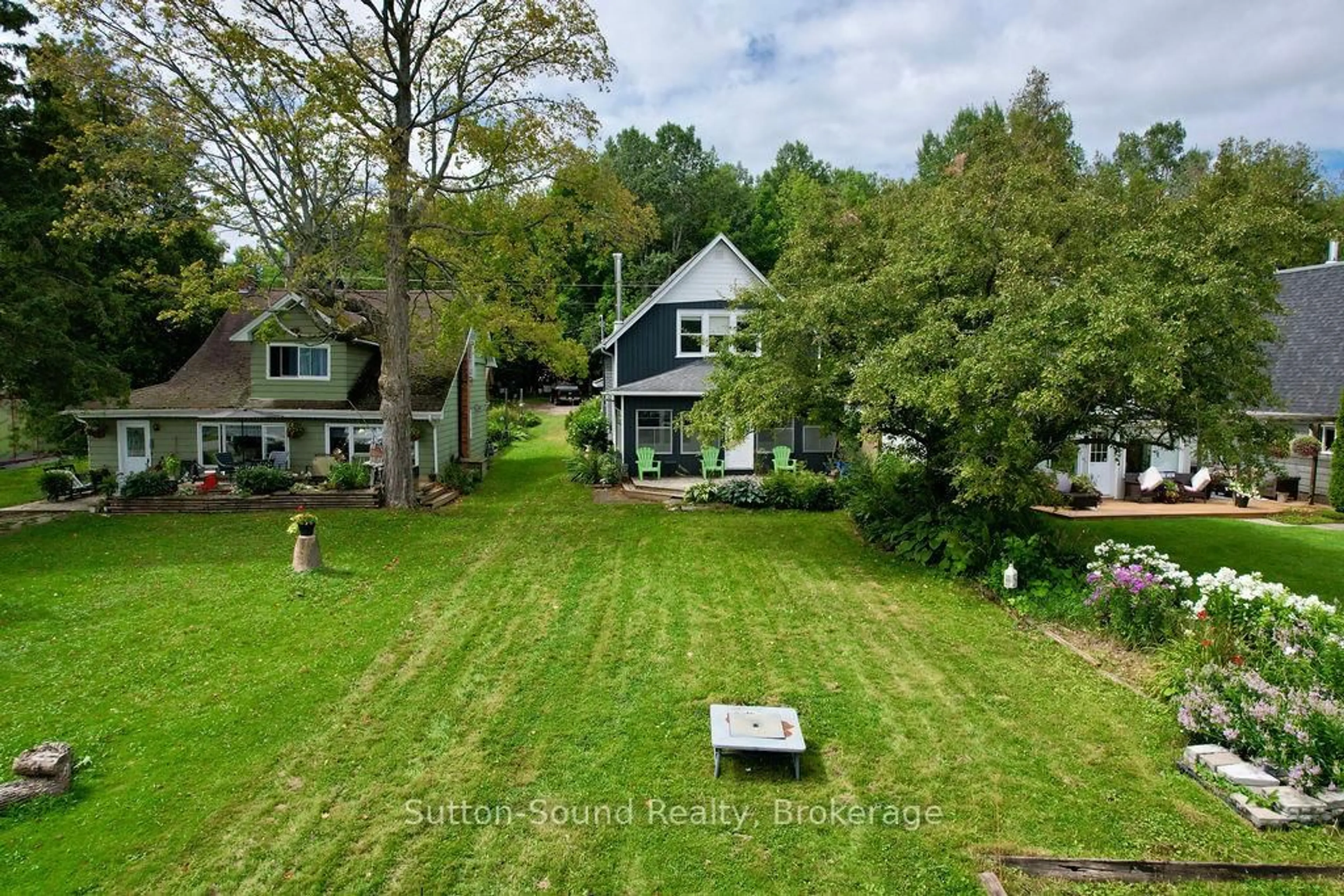 A pic from outside/outdoor area/front of a property/back of a property/a pic from drone, water/lake/river/ocean view for 166 Old Beach Dr, Georgian Bluffs Ontario N4K 5N4