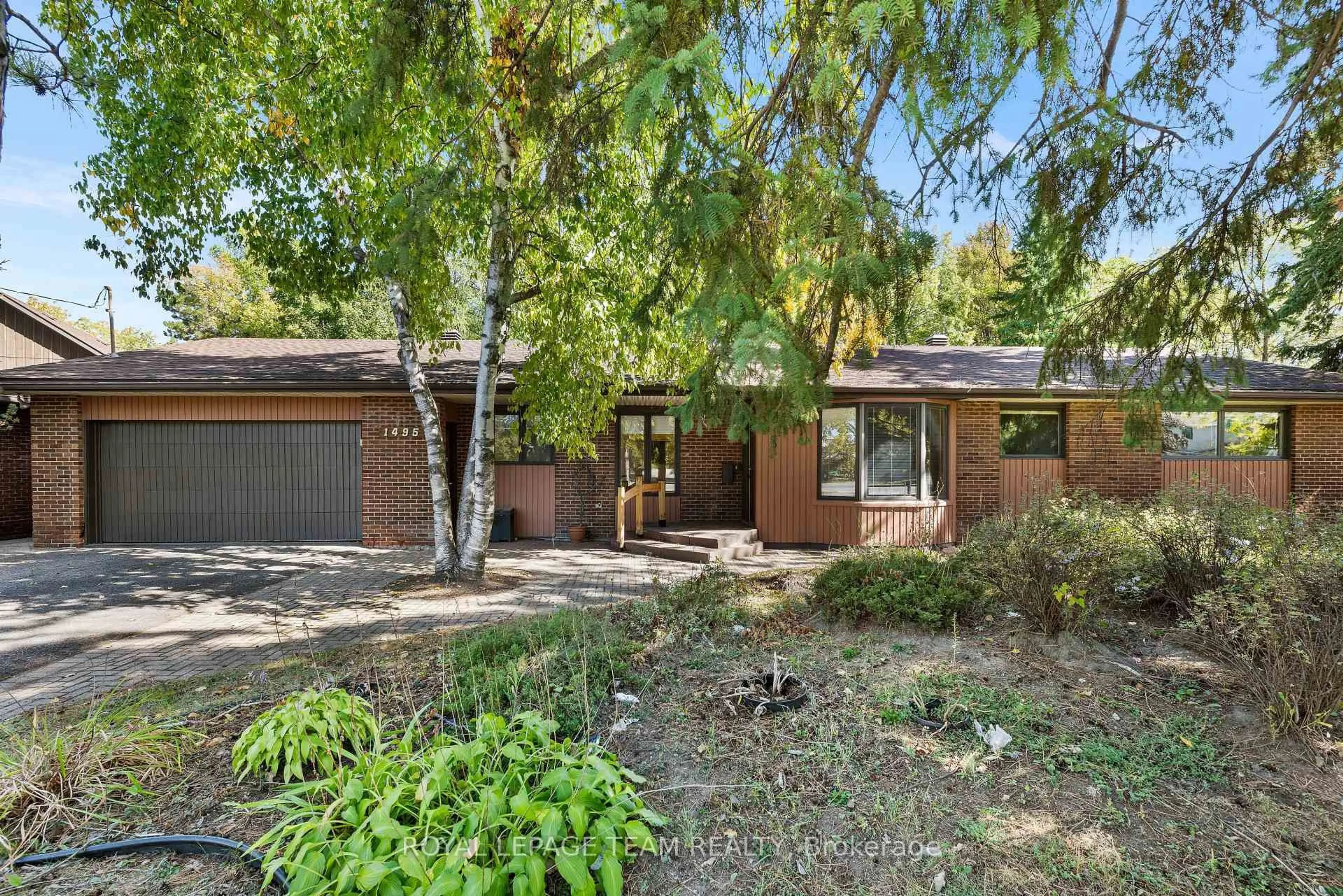 Home with brick exterior material, street for 1495 Prince Of Wales Dr, Ottawa Ontario K2C 1N8