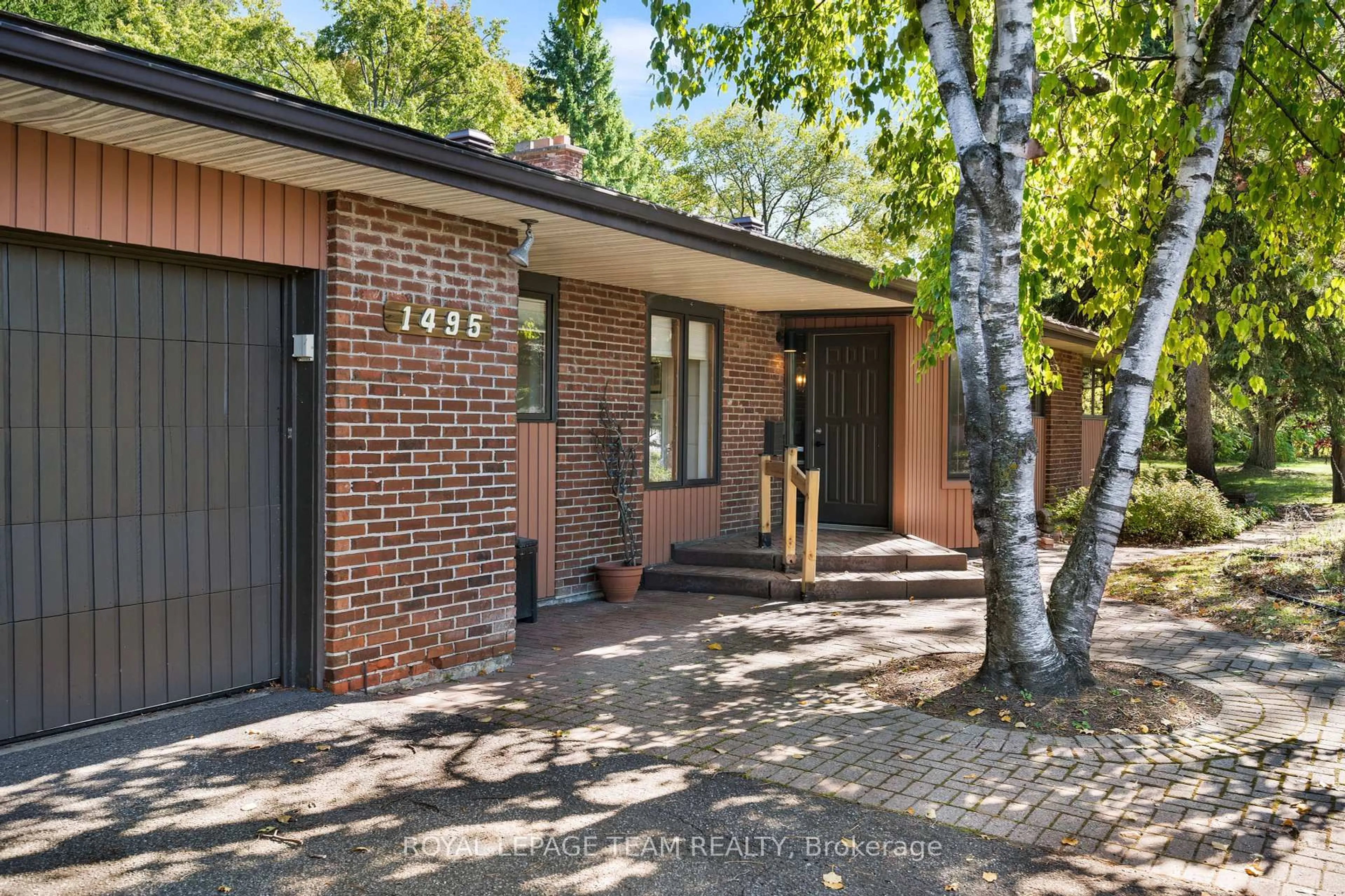 Home with brick exterior material, street for 1495 Prince Of Wales Dr, Ottawa Ontario K2C 1N8