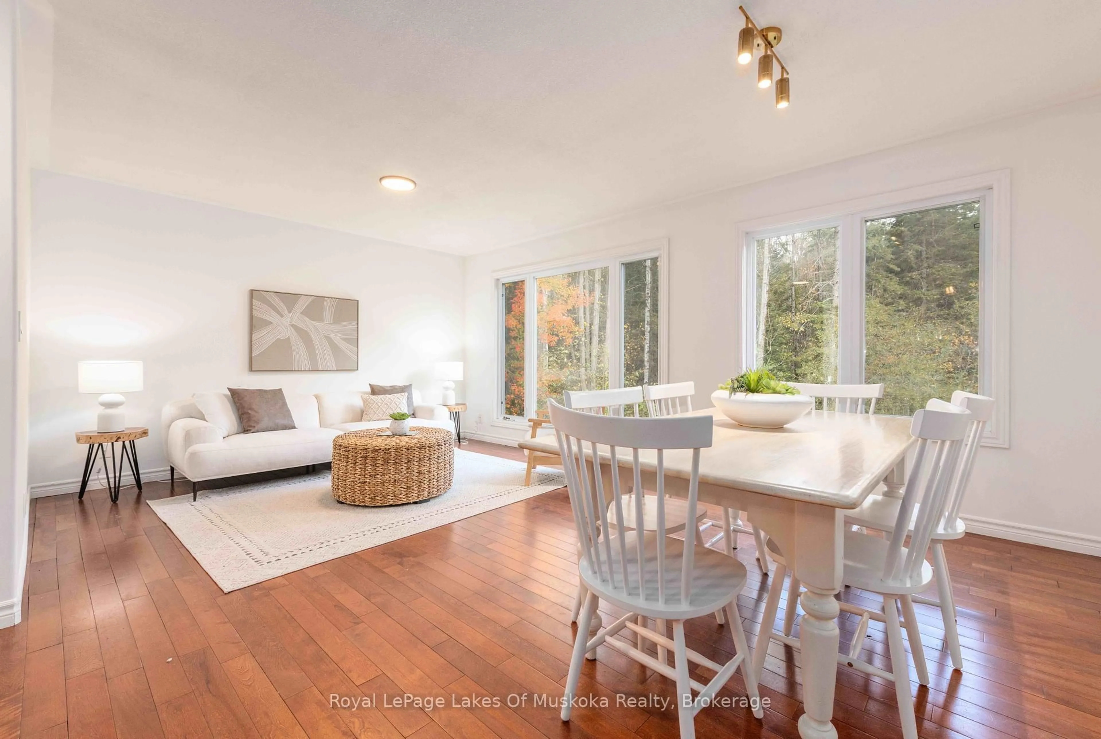 Living room with furniture, wood/laminate floor for 134 Chaffey Township Rd, Huntsville Ontario P1H 1C8