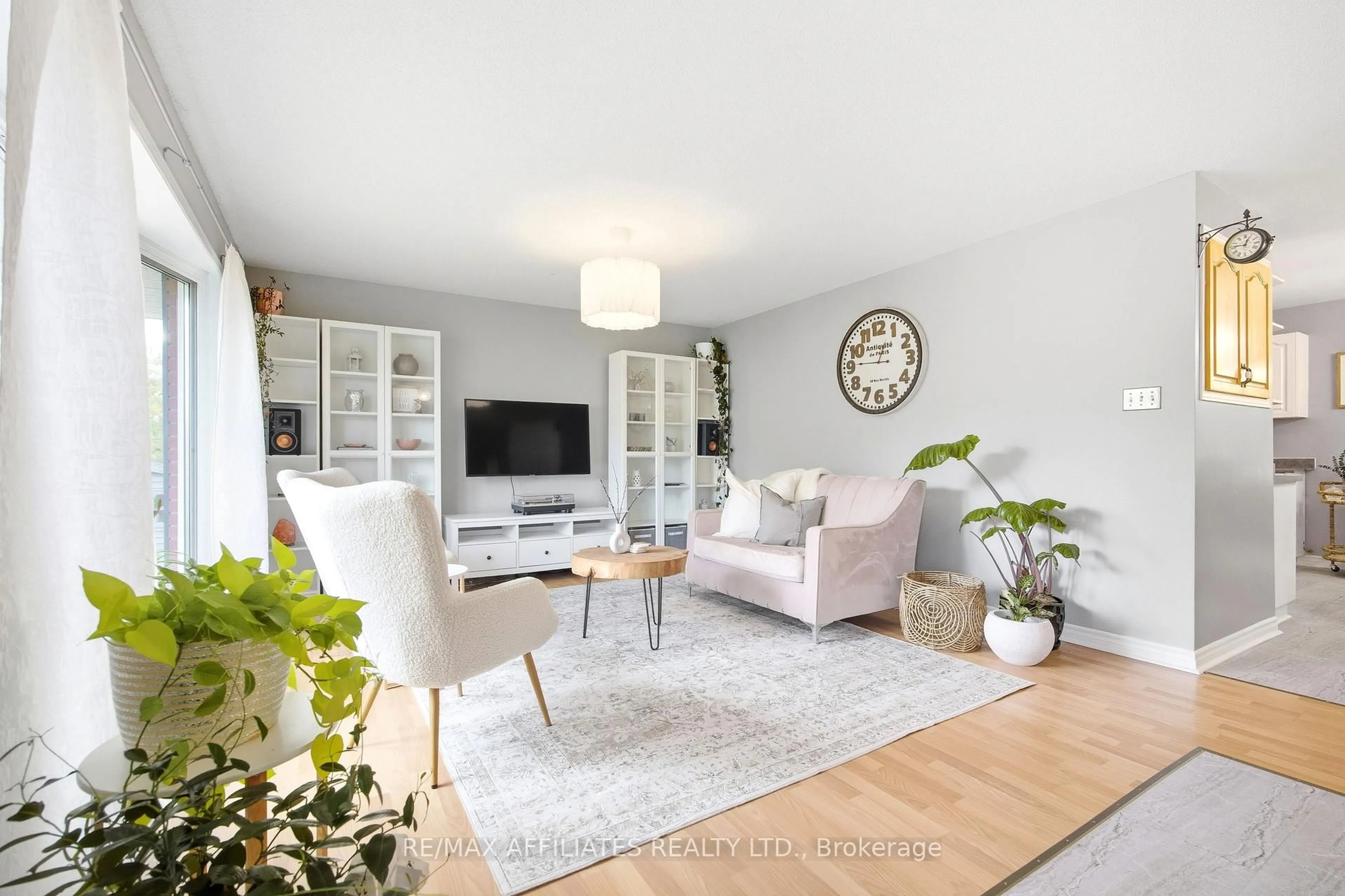 Living room with furniture, wood/laminate floor for 121 Stamford Dr, Perth Ontario K7H 3C1