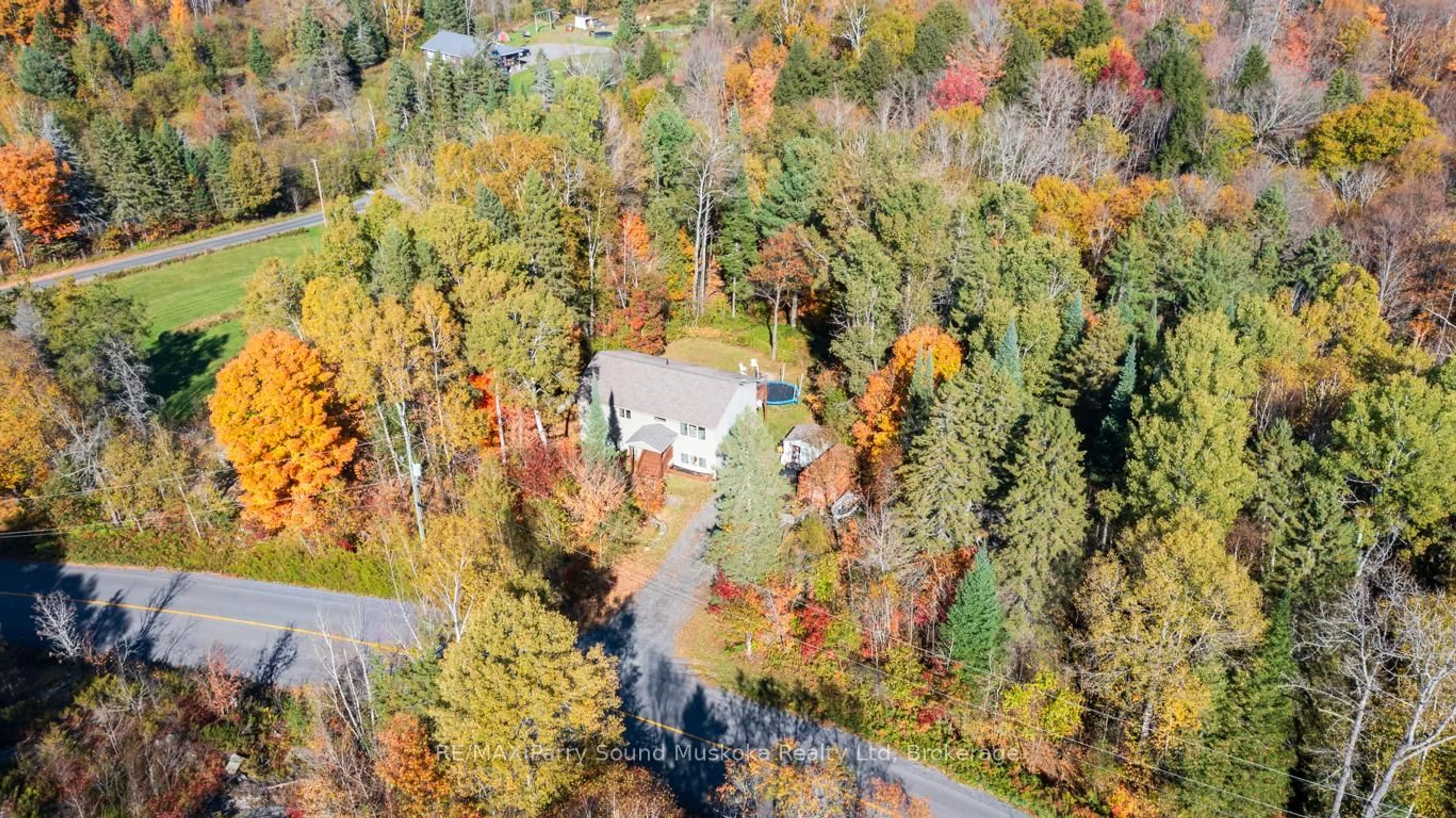 A pic from outside/outdoor area/front of a property/back of a property/a pic from drone, forest/trees view for 312 Centre Rd, McKellar Ontario P2A 0B4
