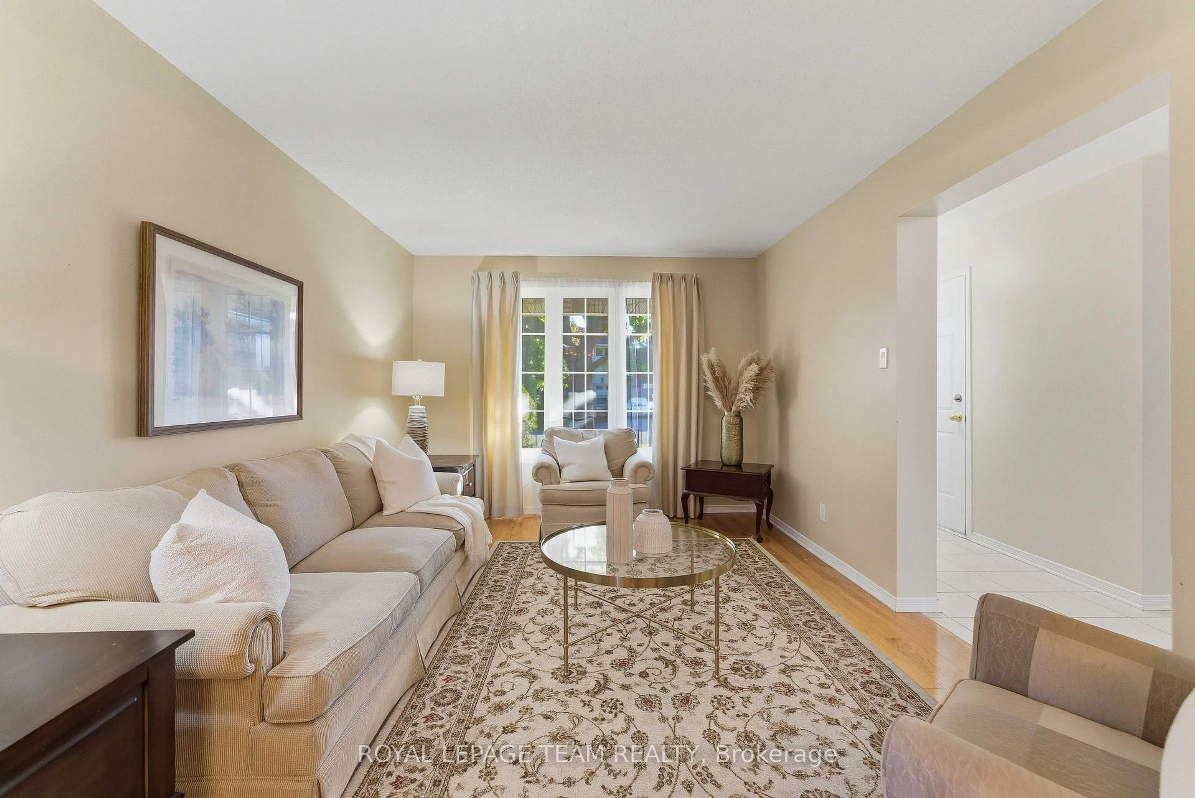 Living room with furniture, carpet floor for 54 Pickwick Dr, Ottawa Ontario K2J 3E8