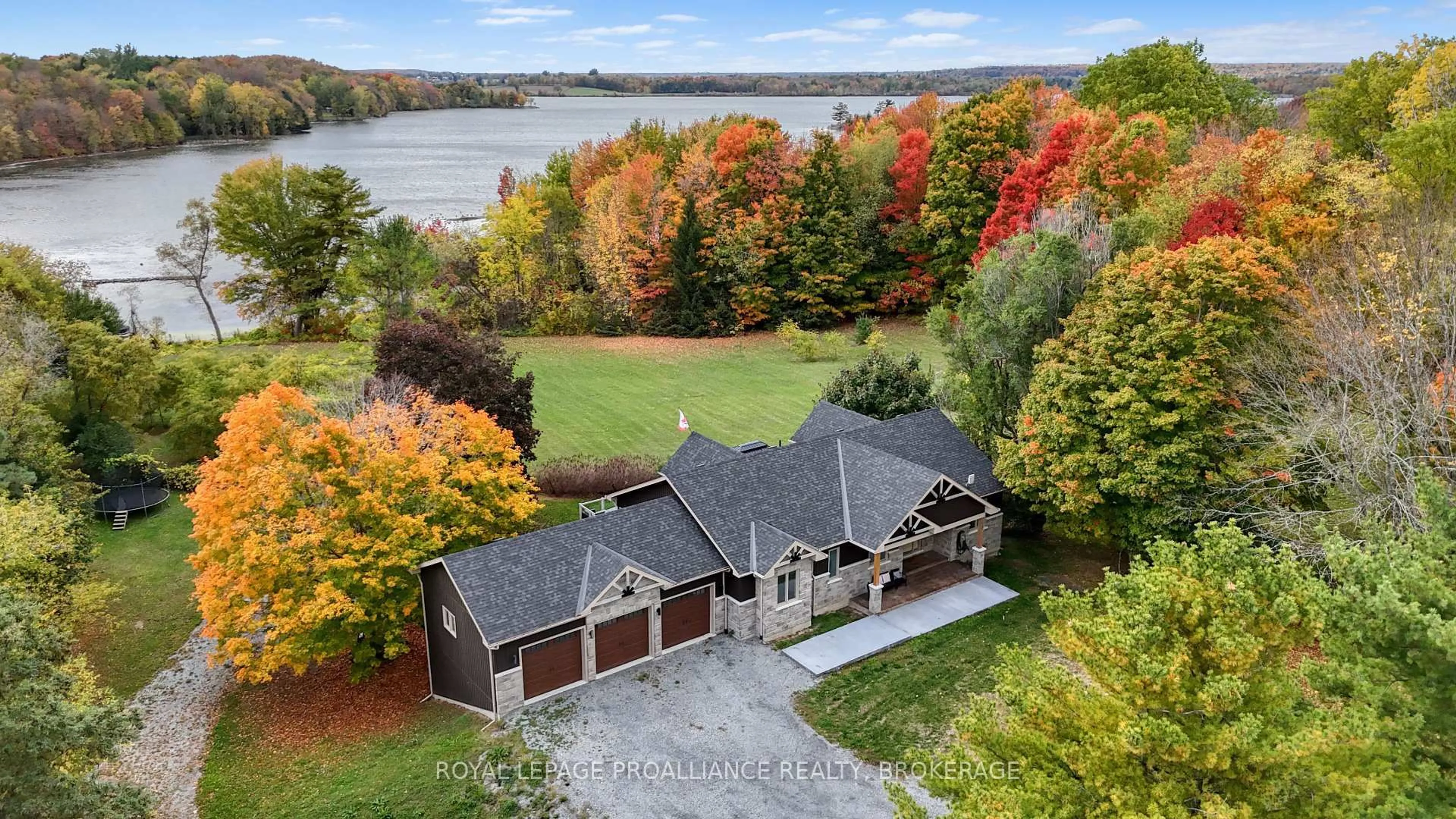A pic from outside/outdoor area/front of a property/back of a property/a pic from drone, water/lake/river/ocean view for 1888 Sunbury Rd, Inverary Ontario K0H 1X0