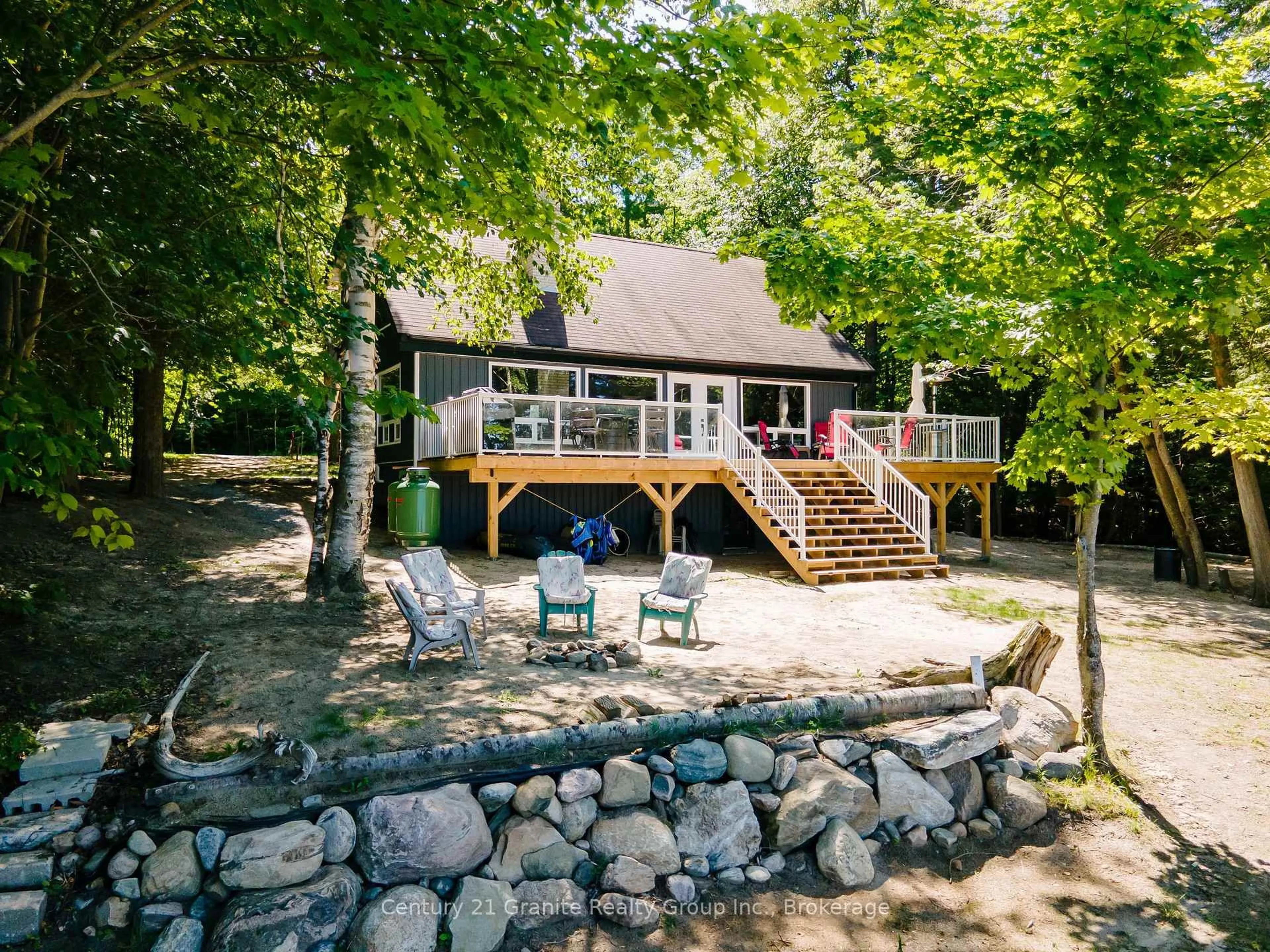A pic from outside/outdoor area/front of a property/back of a property/a pic from drone, water/lake/river/ocean view for 2347 Kashagawigamog Lake Rd, Minden Hills Ontario K0M 2K0