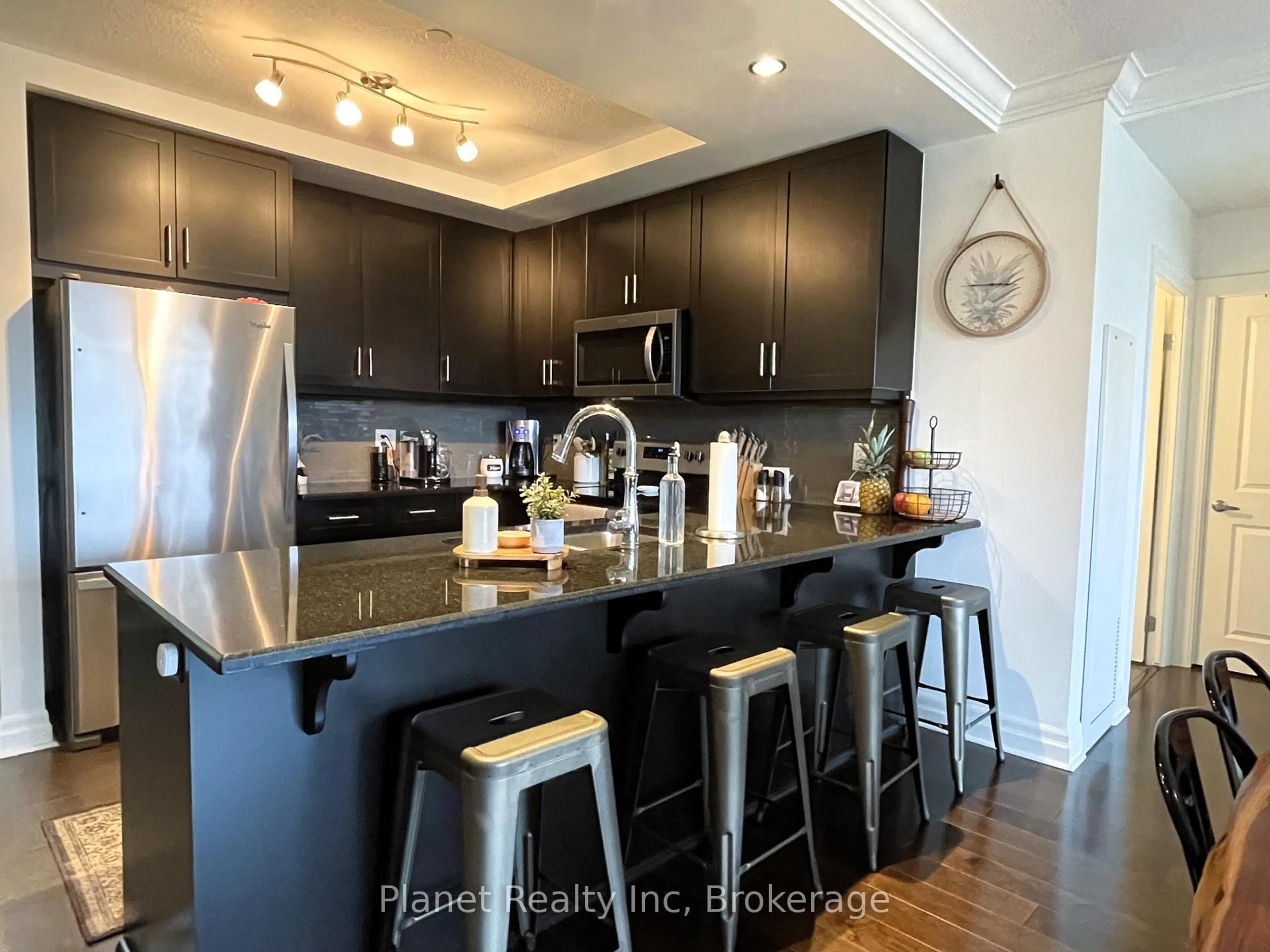 Open concept kitchen, wood/laminate floor for 150 WELLINGTON St #501, Guelph Ontario N1H 0B5