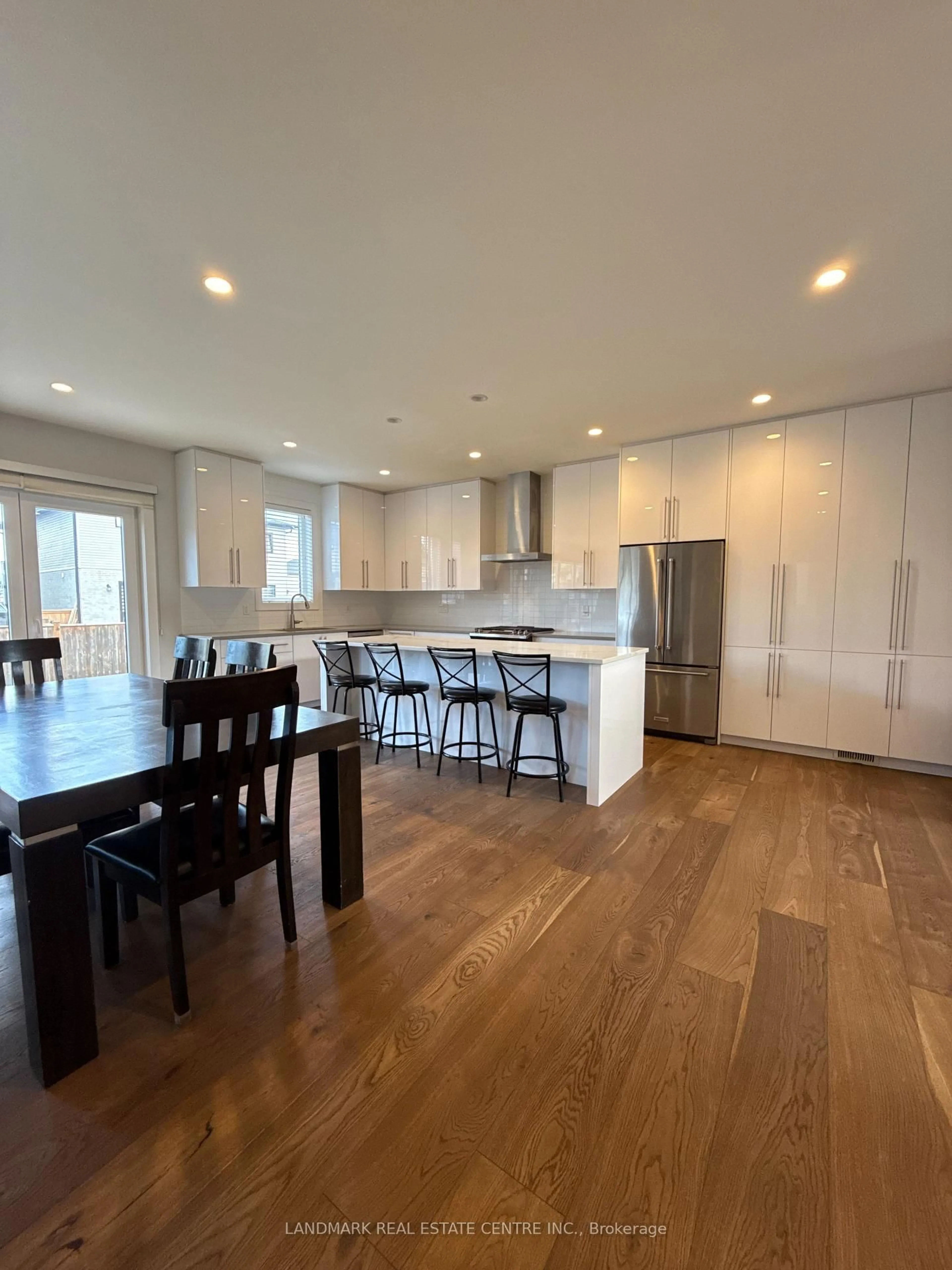 Open concept kitchen, wood/laminate floor for 2170 Debra Dr, London South Ontario N6P 0E5