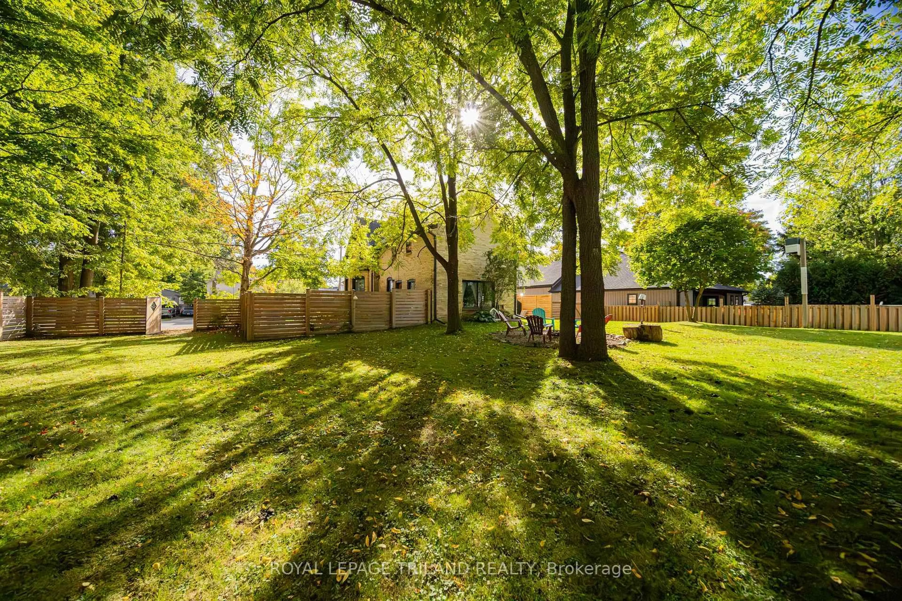 A pic from outside/outdoor area/front of a property/back of a property/a pic from drone, forest/trees view for 190 Emily St, North Middlesex Ontario N0M 2K0