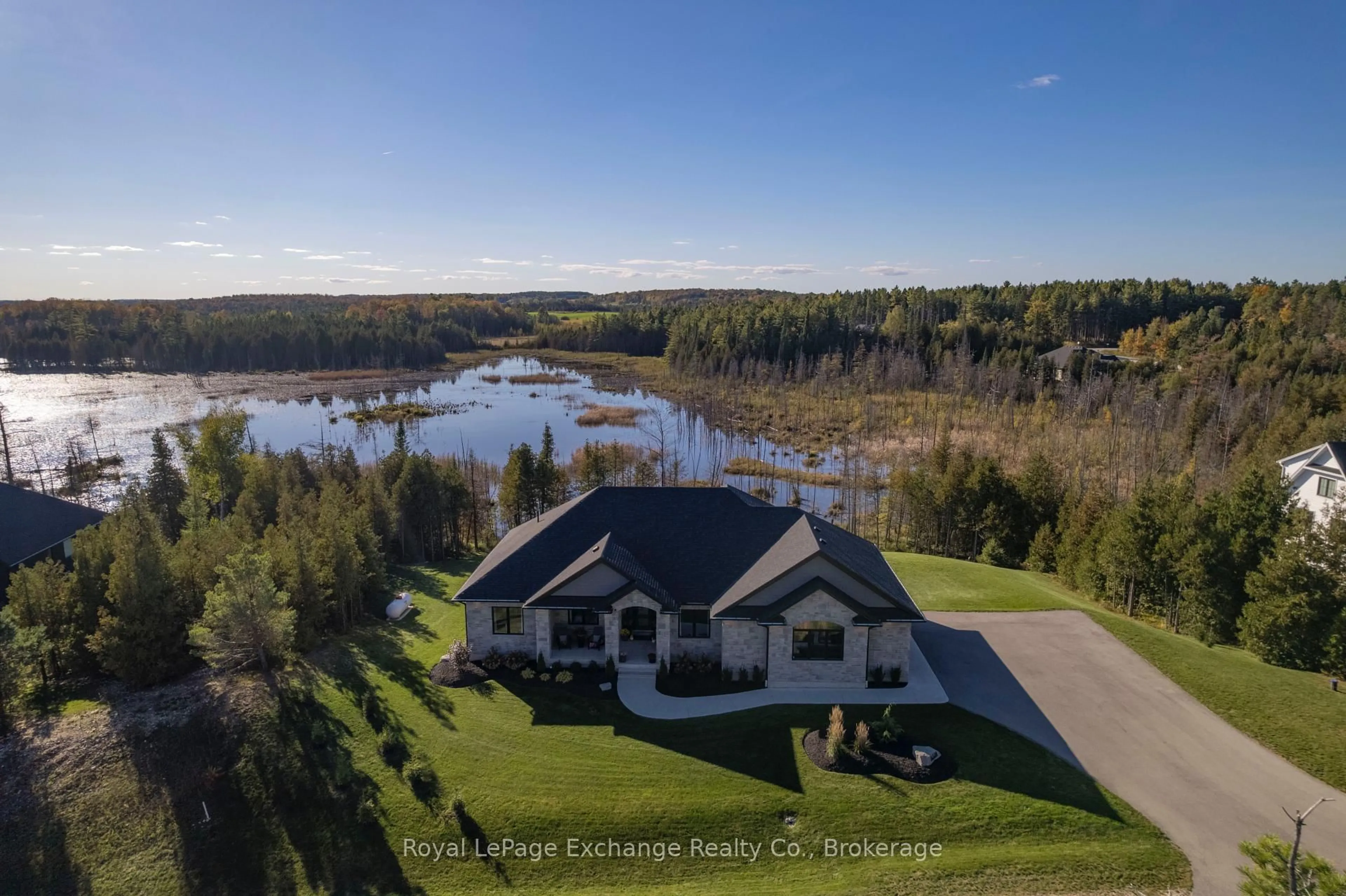 A pic from outside/outdoor area/front of a property/back of a property/a pic from drone, water/lake/river/ocean view for 150 Louise Creek Cres, West Grey Ontario N0G 1S0