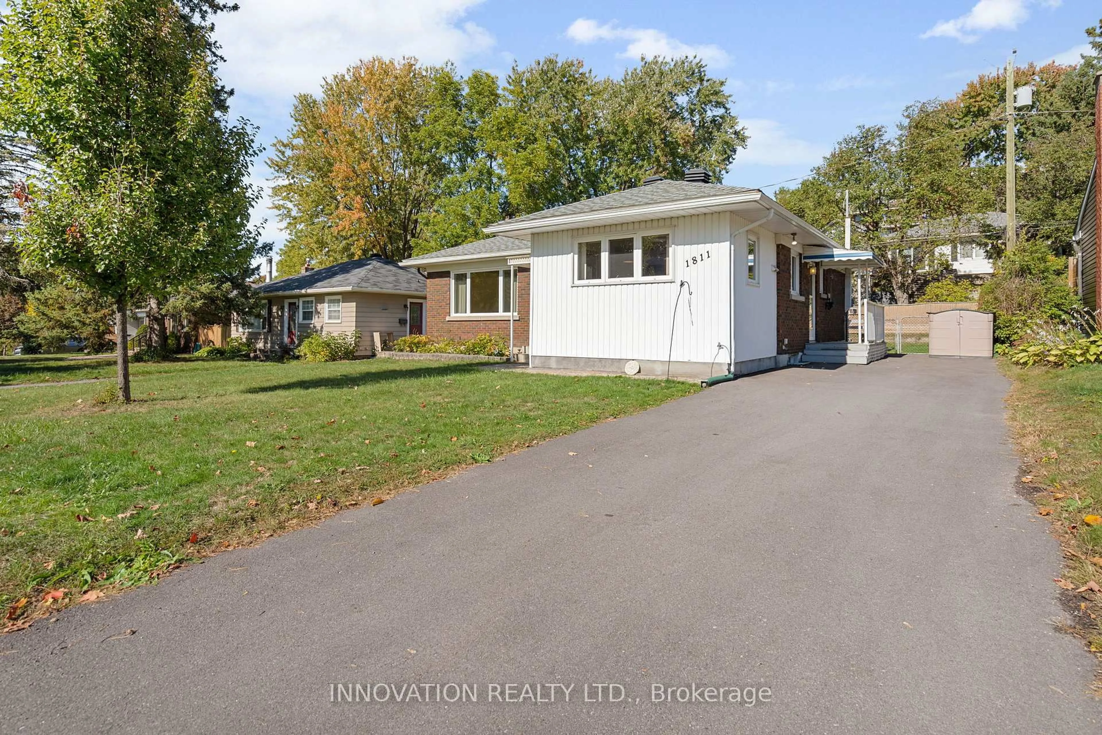 Home with vinyl exterior material, street for 1811 Hutton Ave, Ottawa Ontario K1G 1M1